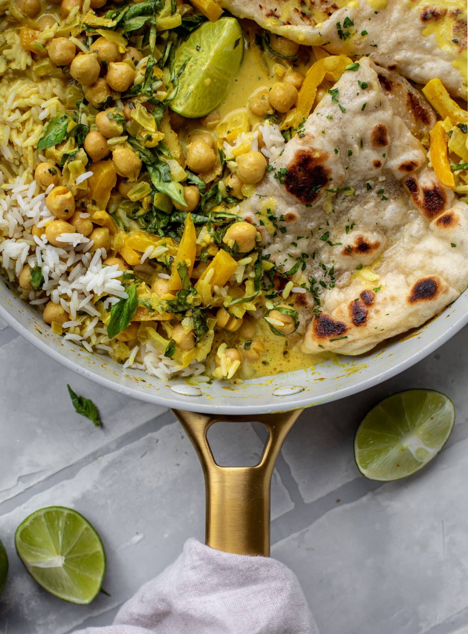 This basil chickpea coconut curry comes together in 20 minutes! Serve with jasmine rice or your favorite naan, or both! So easy and flavorful.