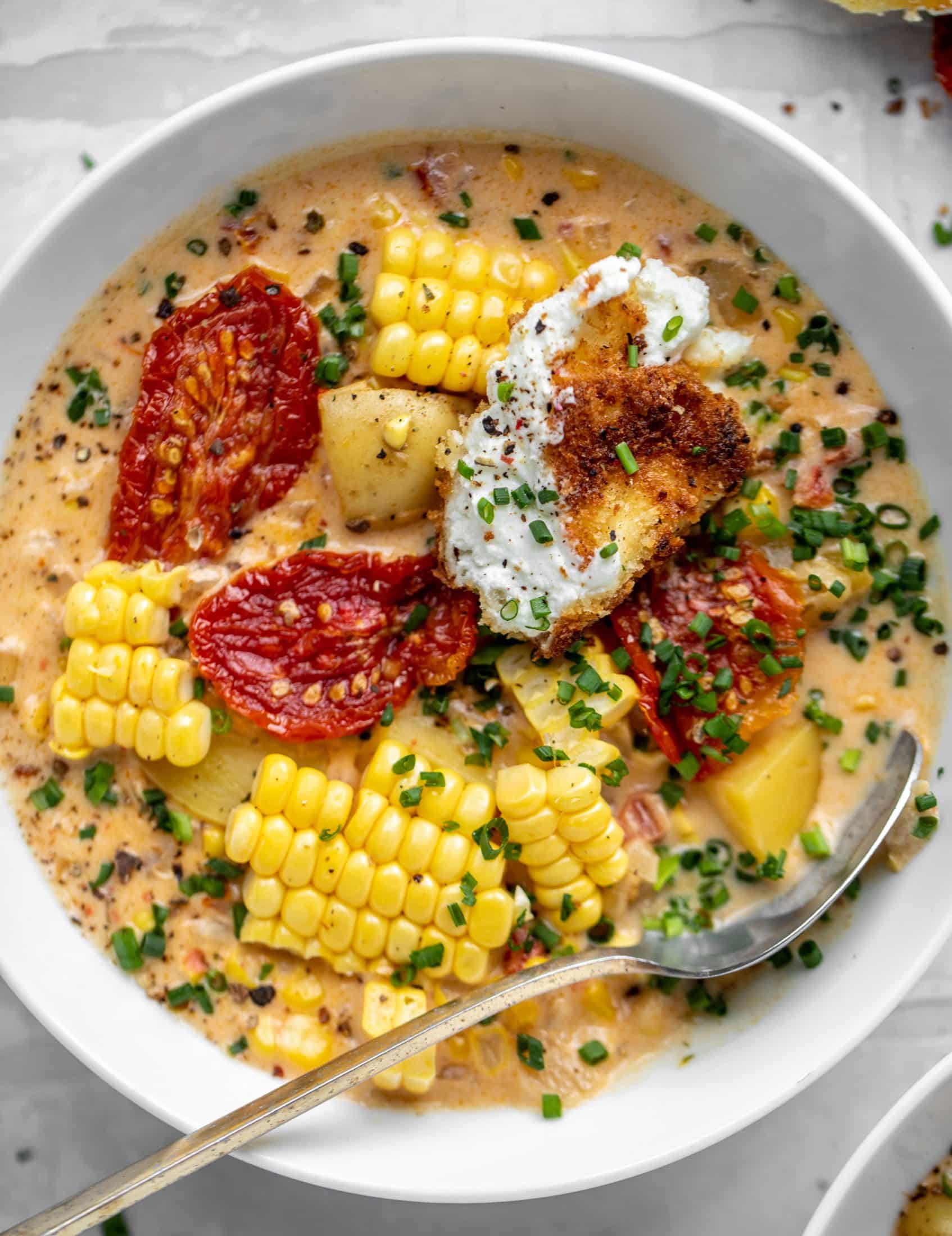 sun dried tomato corn chowder with crispy goat cheese