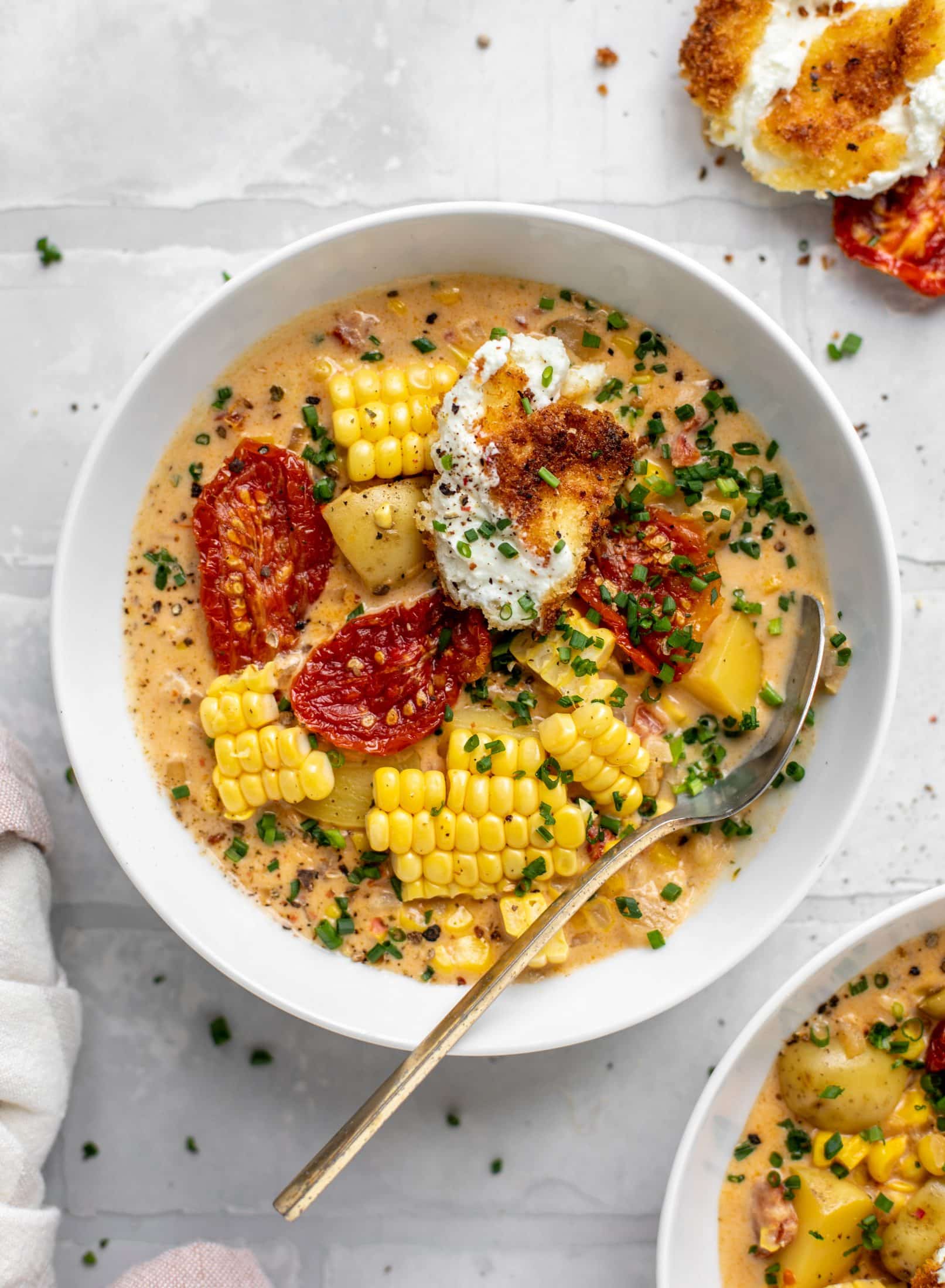 sun dried tomato corn chowder with crispy goat cheese