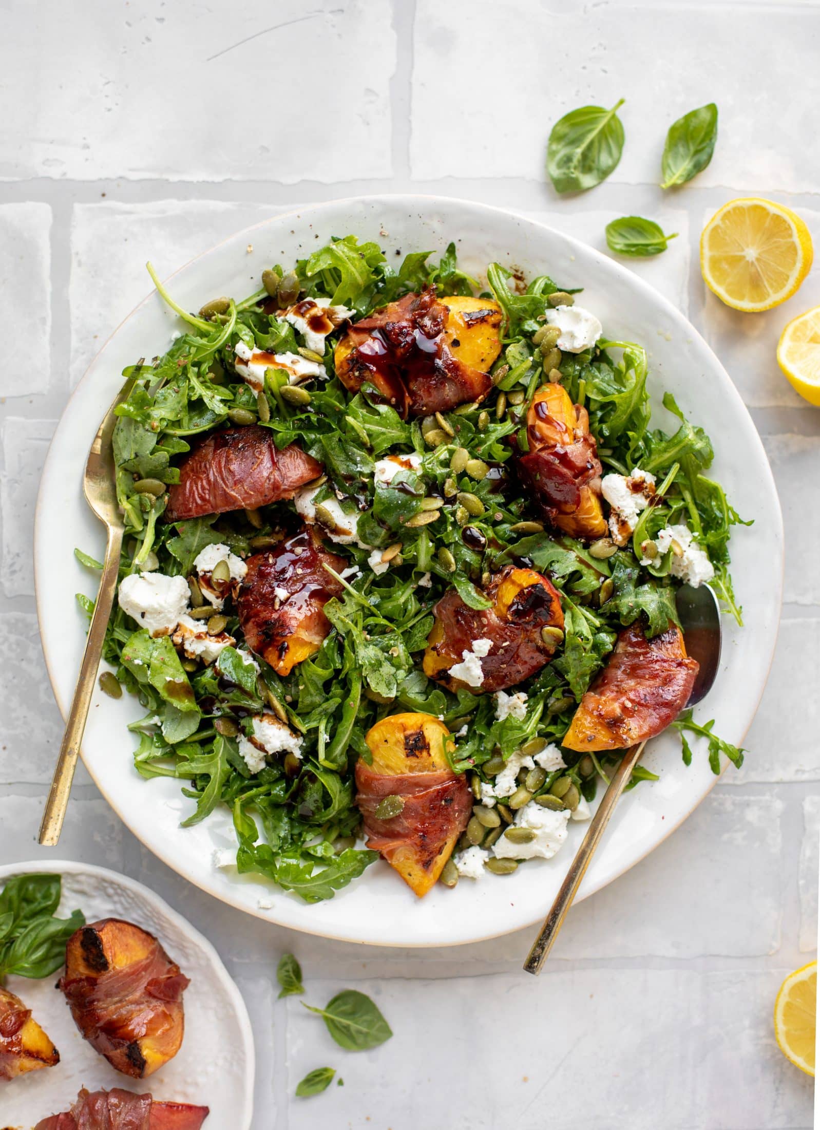 grilled prosciutto wrapped peaches with arugula and goat cheese