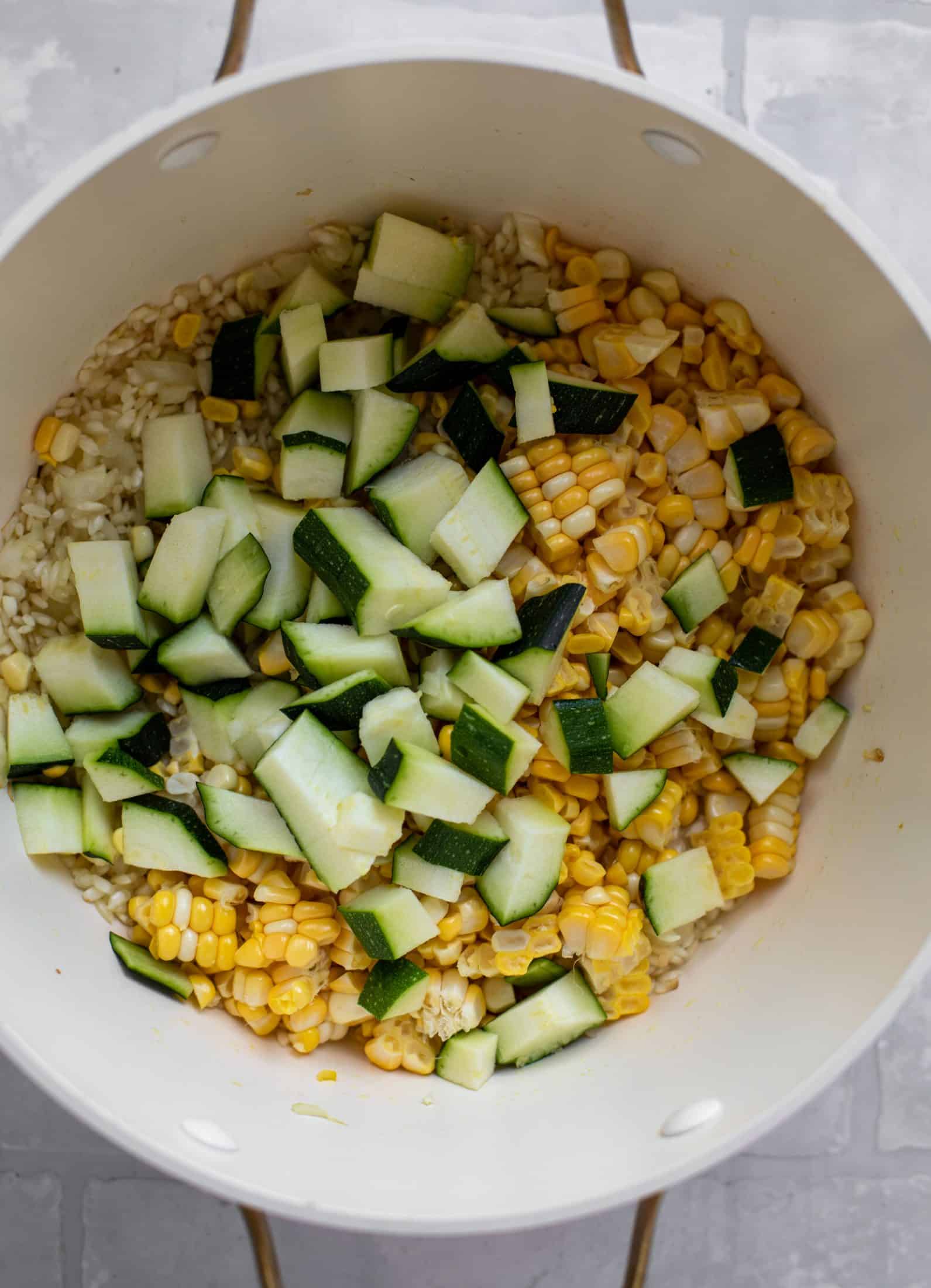 corn and zucchini in risotto pot