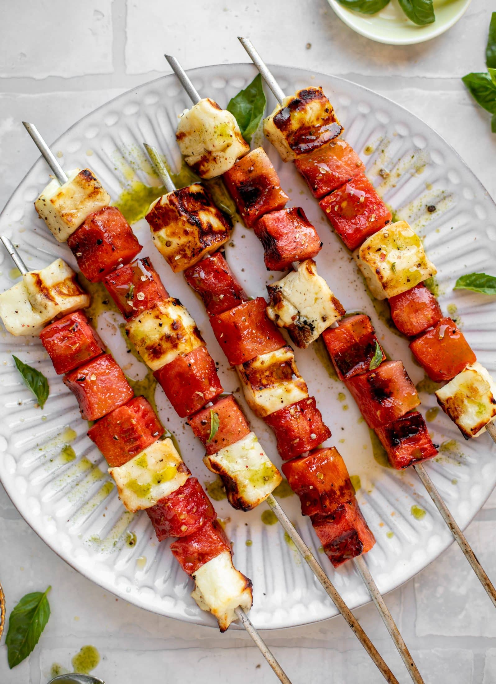 grilled watermelon halloumi skewers with mint basil oil