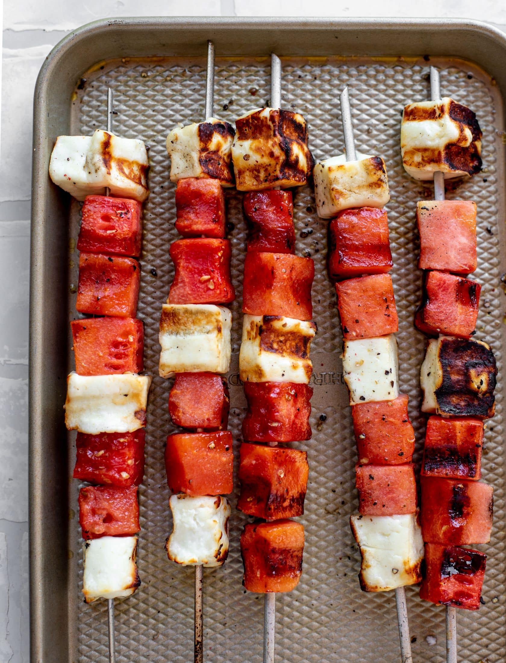 grilled watermelon halloumi skewers right off the grill