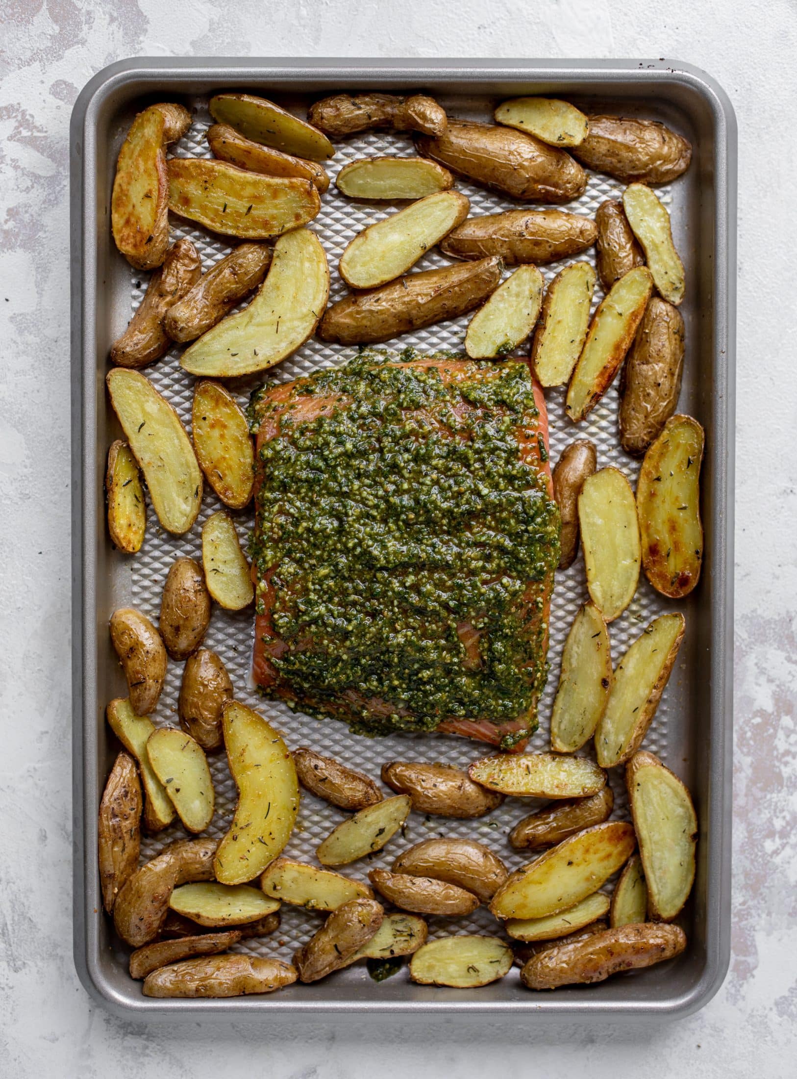 sheet pan pesto salmon ready for the oven
