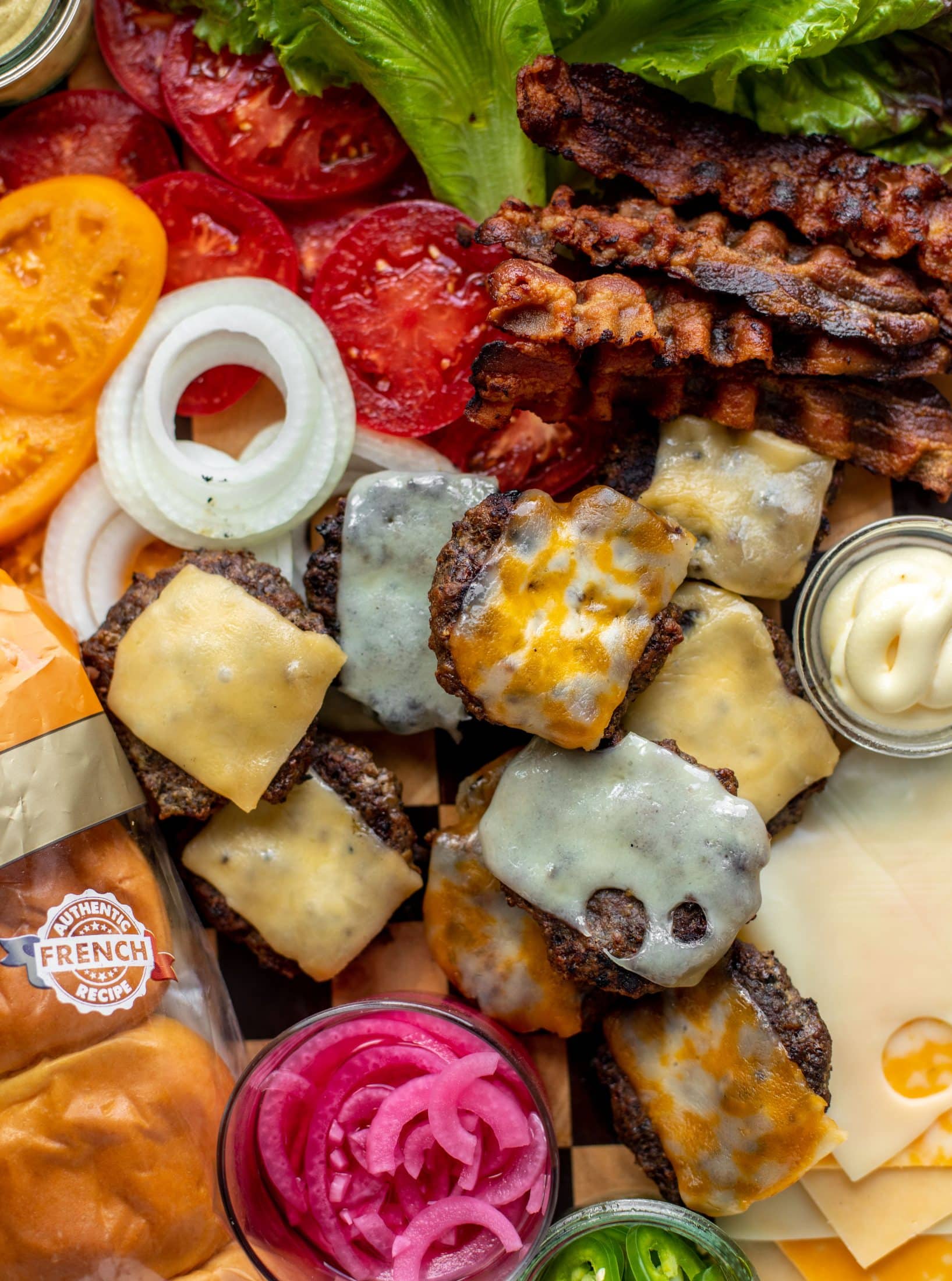 cheeseburgers, bacon, tomatoes, lettuce, picked onions