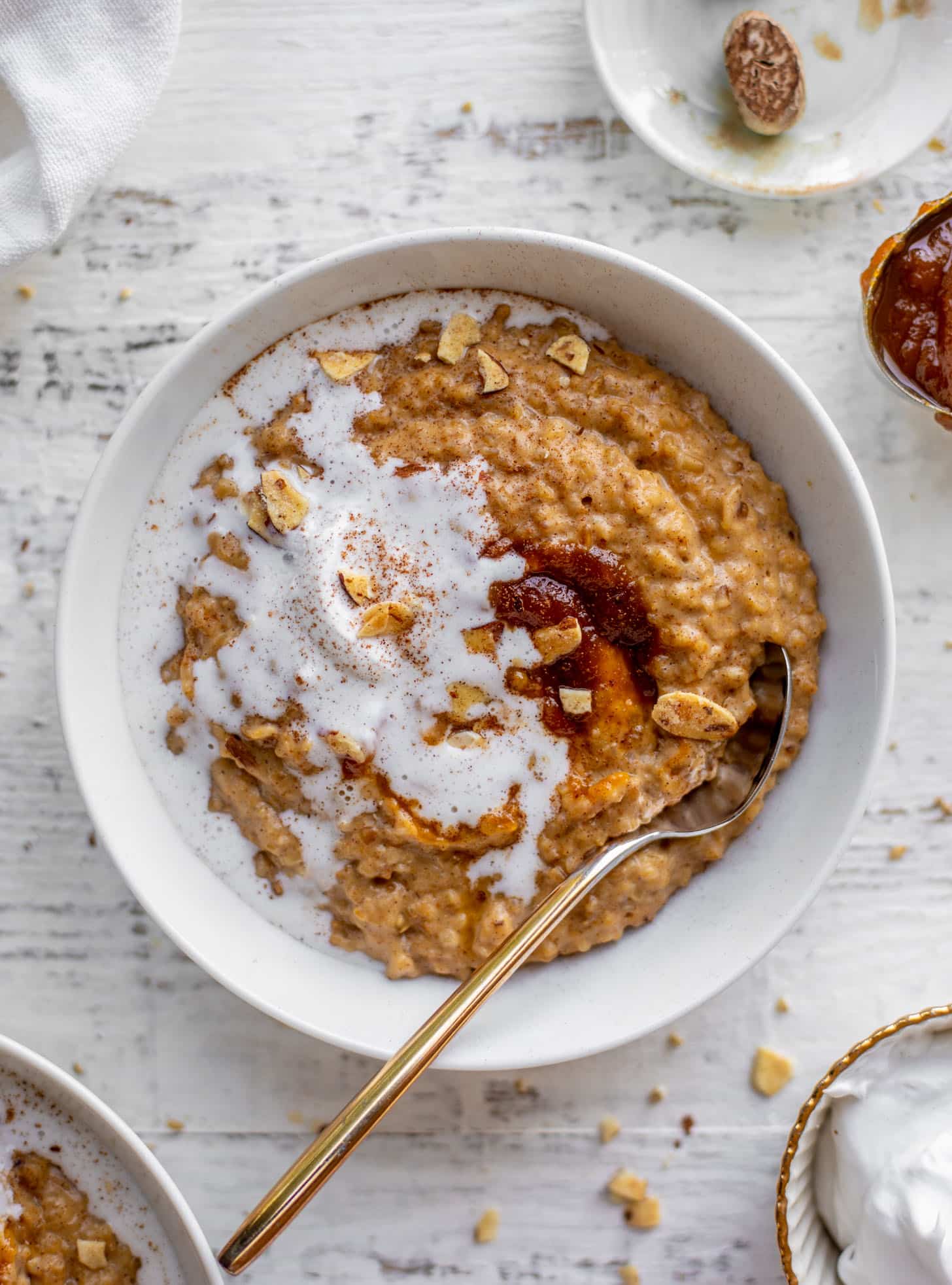 pumpkin pie oatmeal with coconut cream and almonds