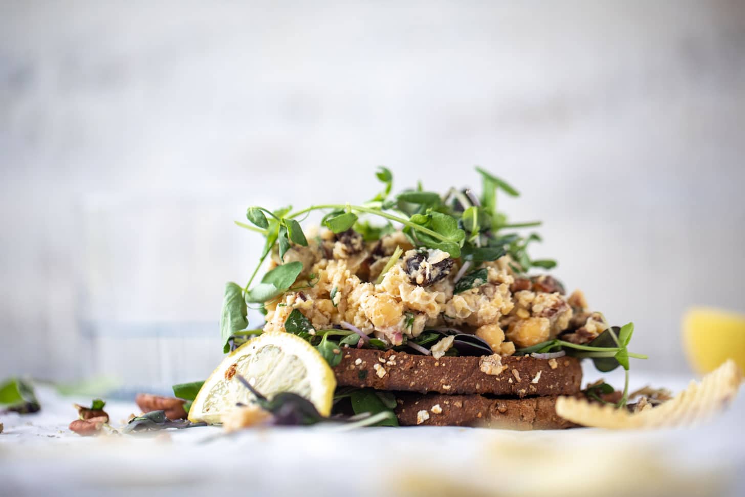 smashed chickpea salad on toast with micro greens