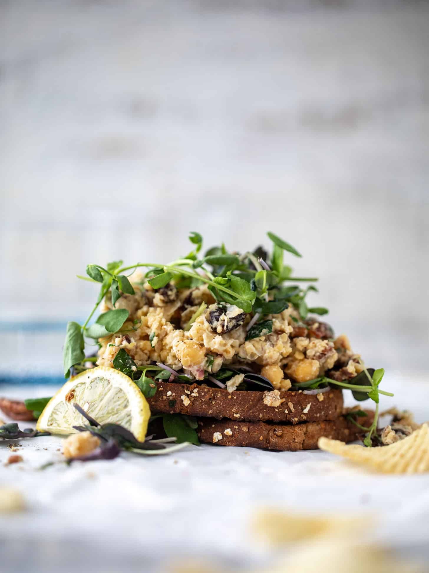 smashed chickpea salad on toast with micro greens