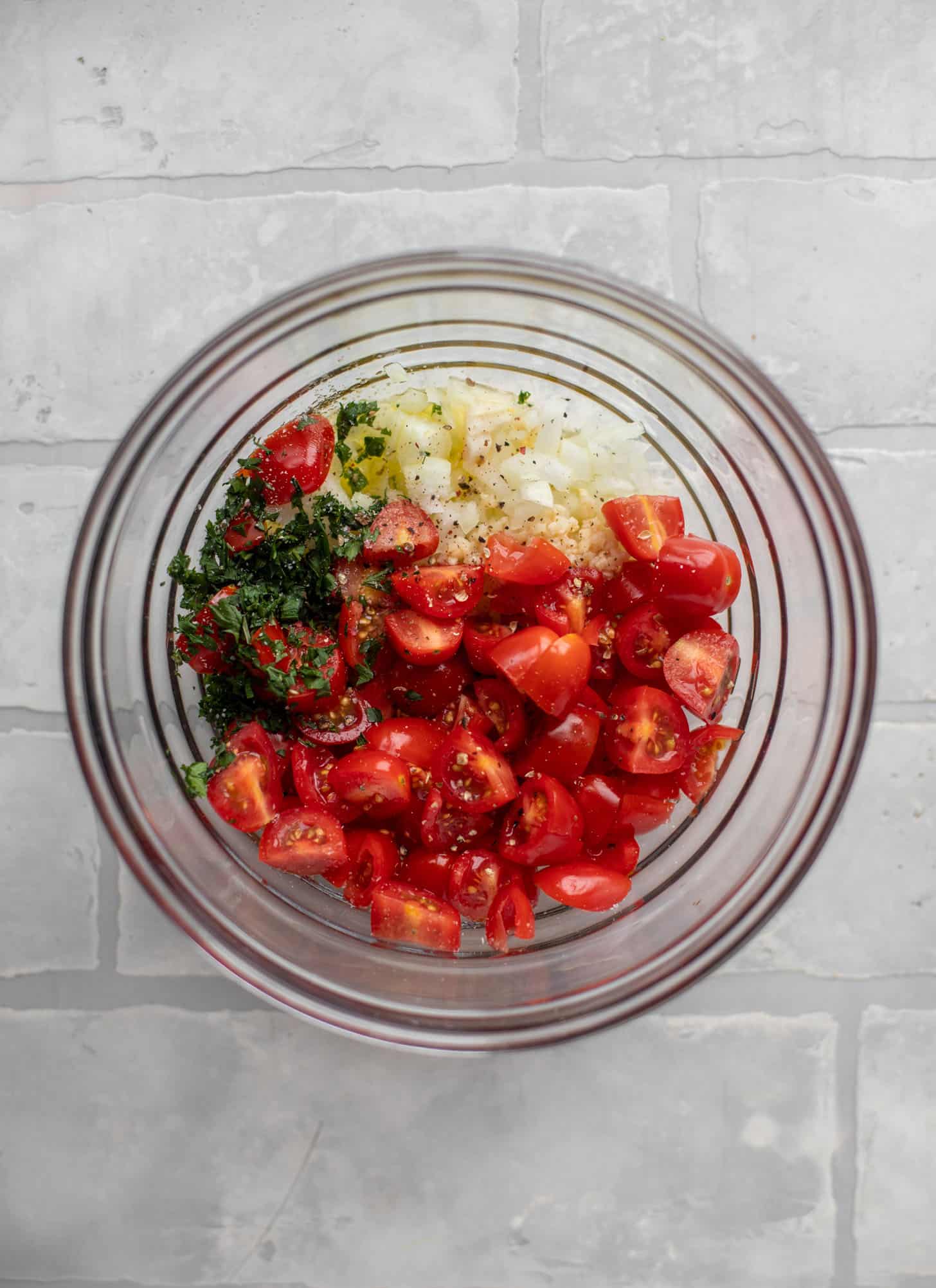 tomatoes, basil, onion, garlic in a bowl