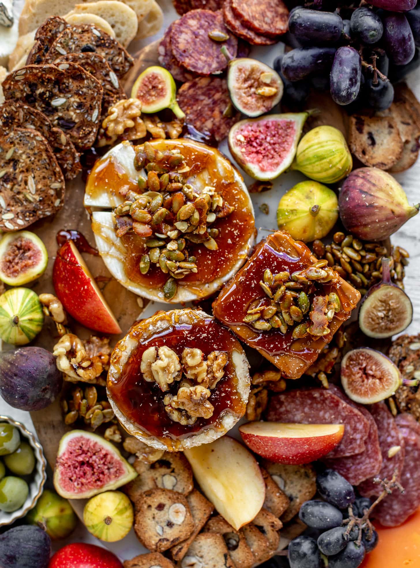 autumn cheese board with bourbon crackling caramel and honey roasted pepitas