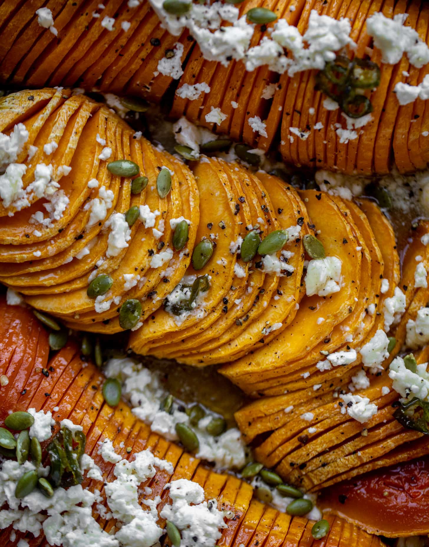 hot honey hasselback butternut squash with feta and pepitas