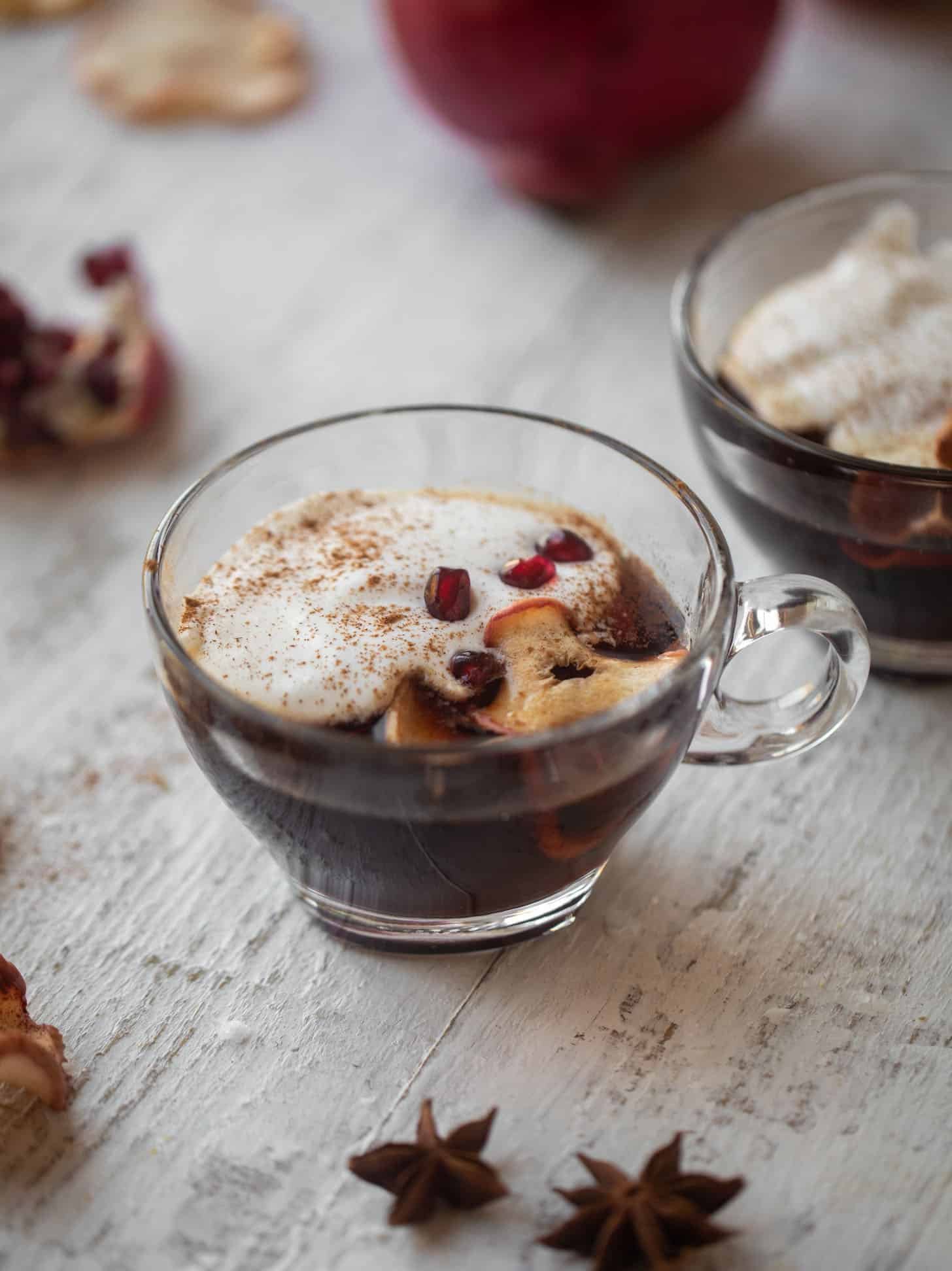 hot pomegranate cider with whipped cream