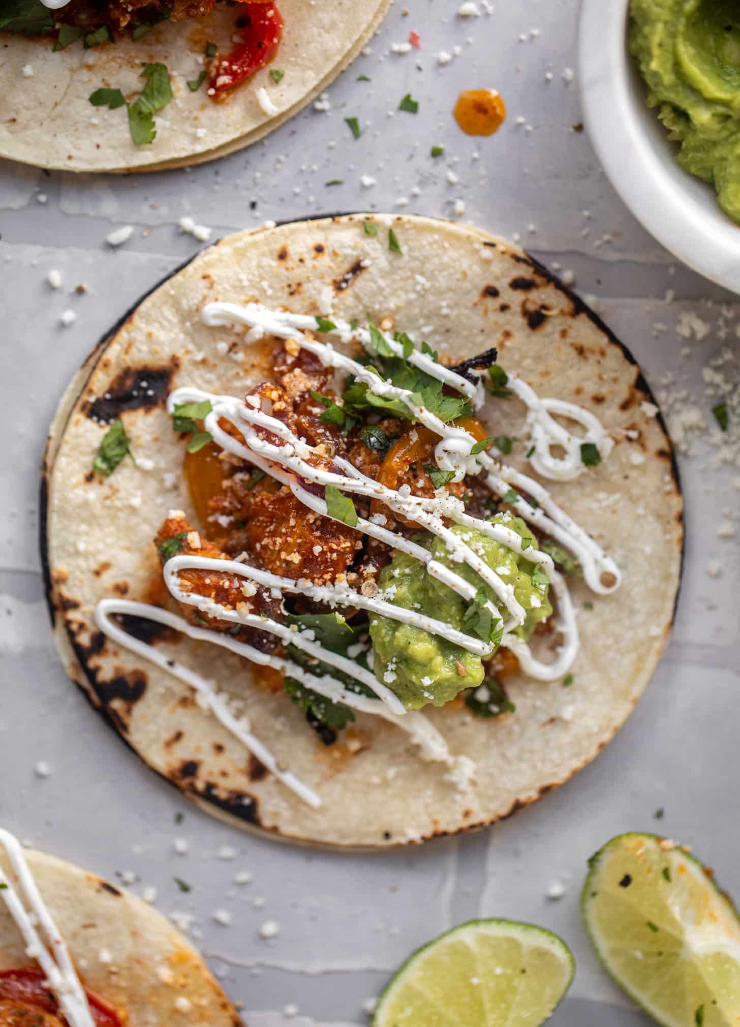 sheet pan chicken fajitas on a tortilla