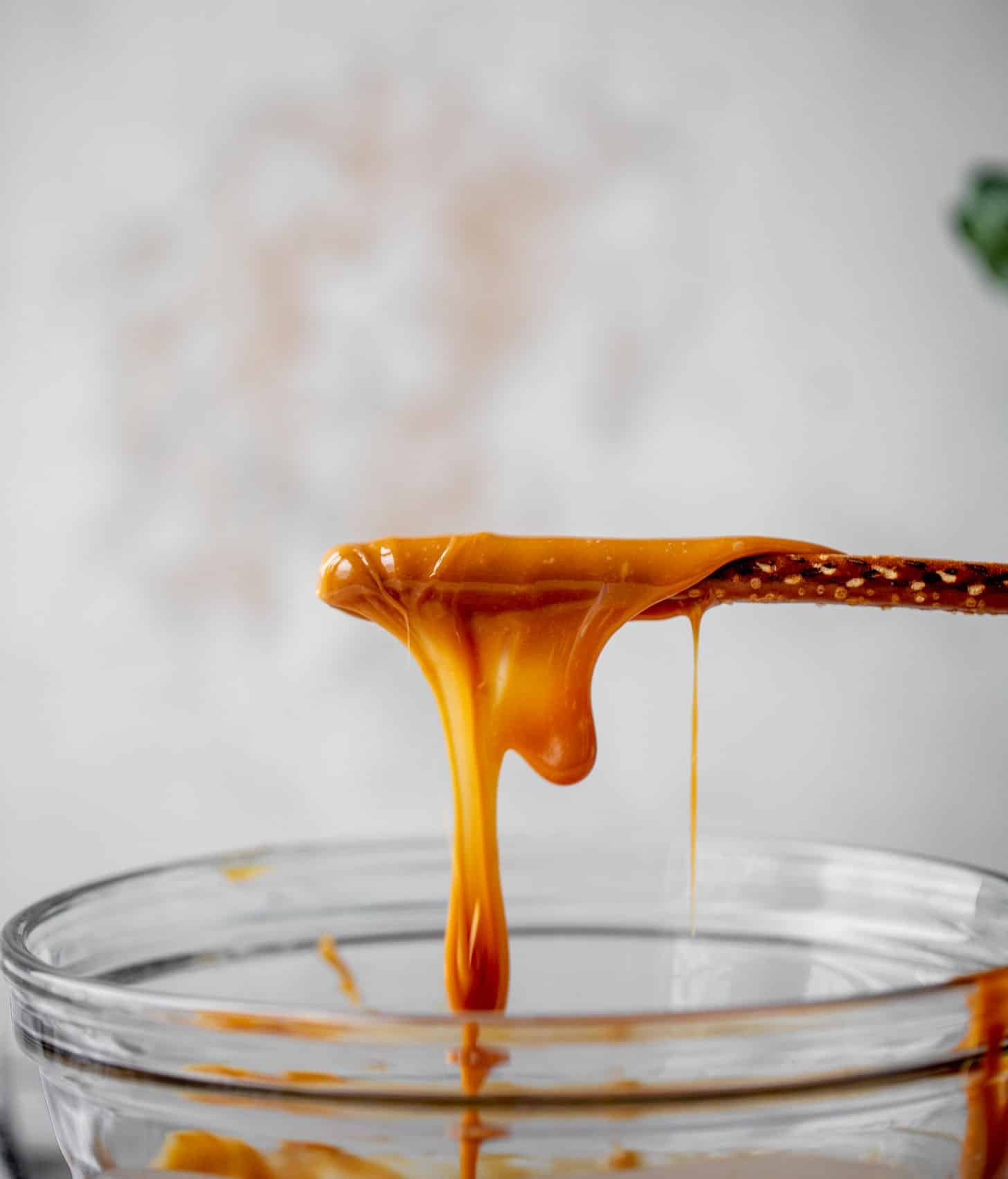 dipping pretzels in caramel