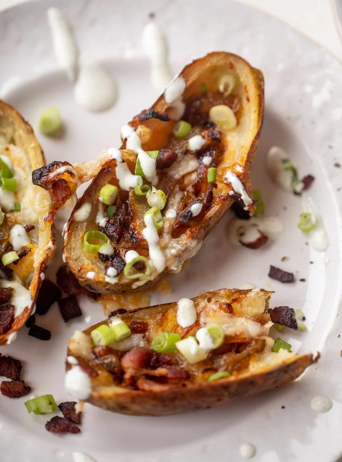smoked cheddar and caramelized onion potato skins with ranch
