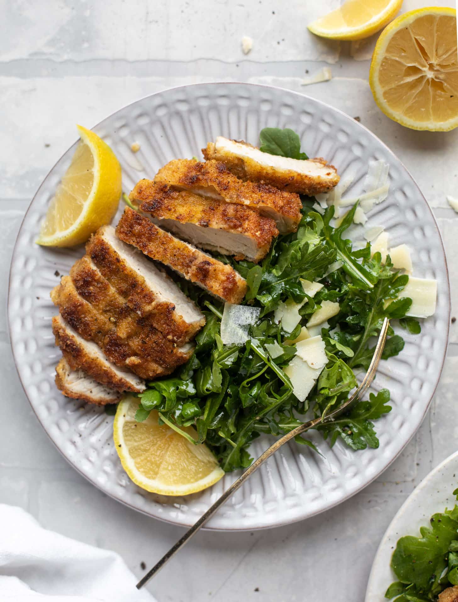 pork milanese with lemon arugula greens