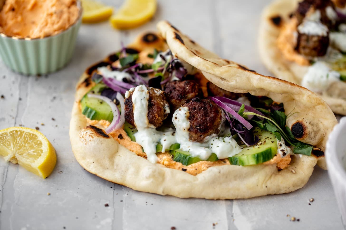 chicken meatball pitas with roasted red pepper whipped feta