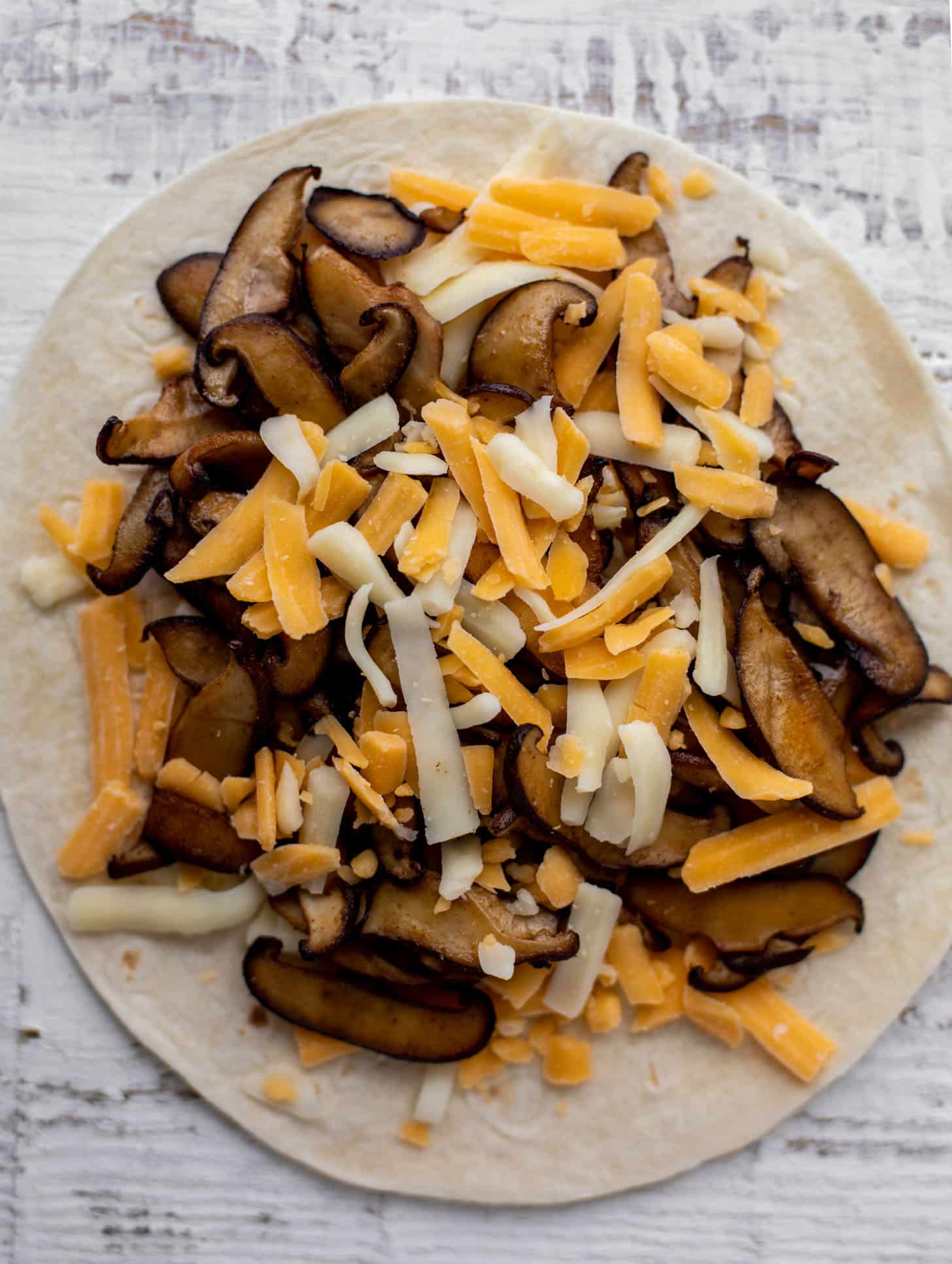 mushroom and cheese on tortilla