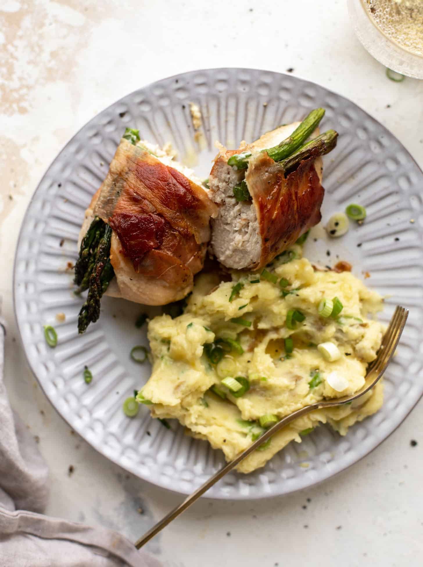 prosciutto wrapped asparagus stuffed chicken with scallion smashed potatoes