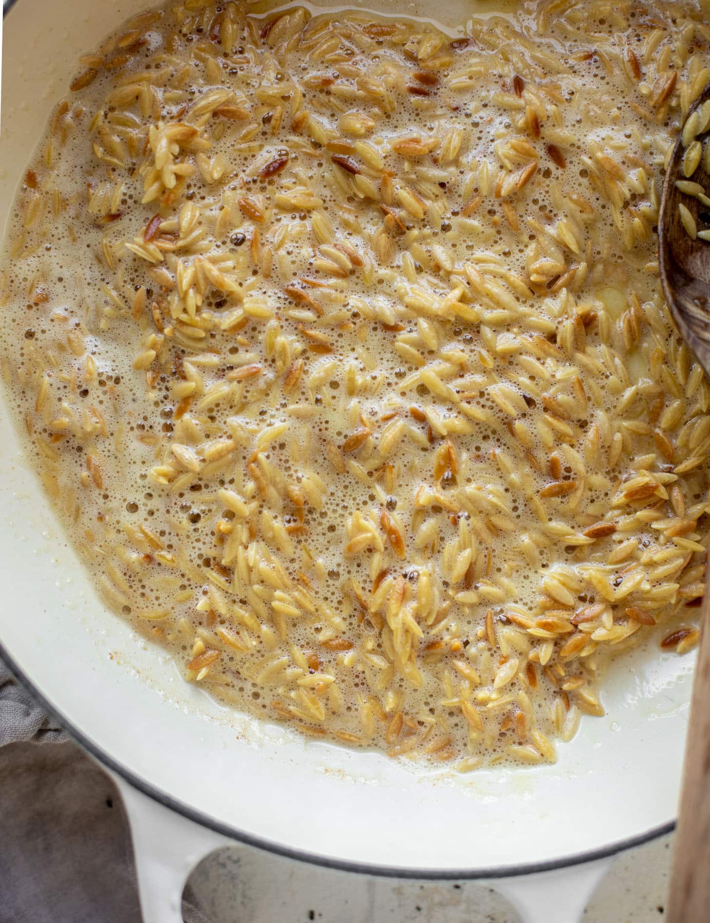 orzo toasting in brown butter