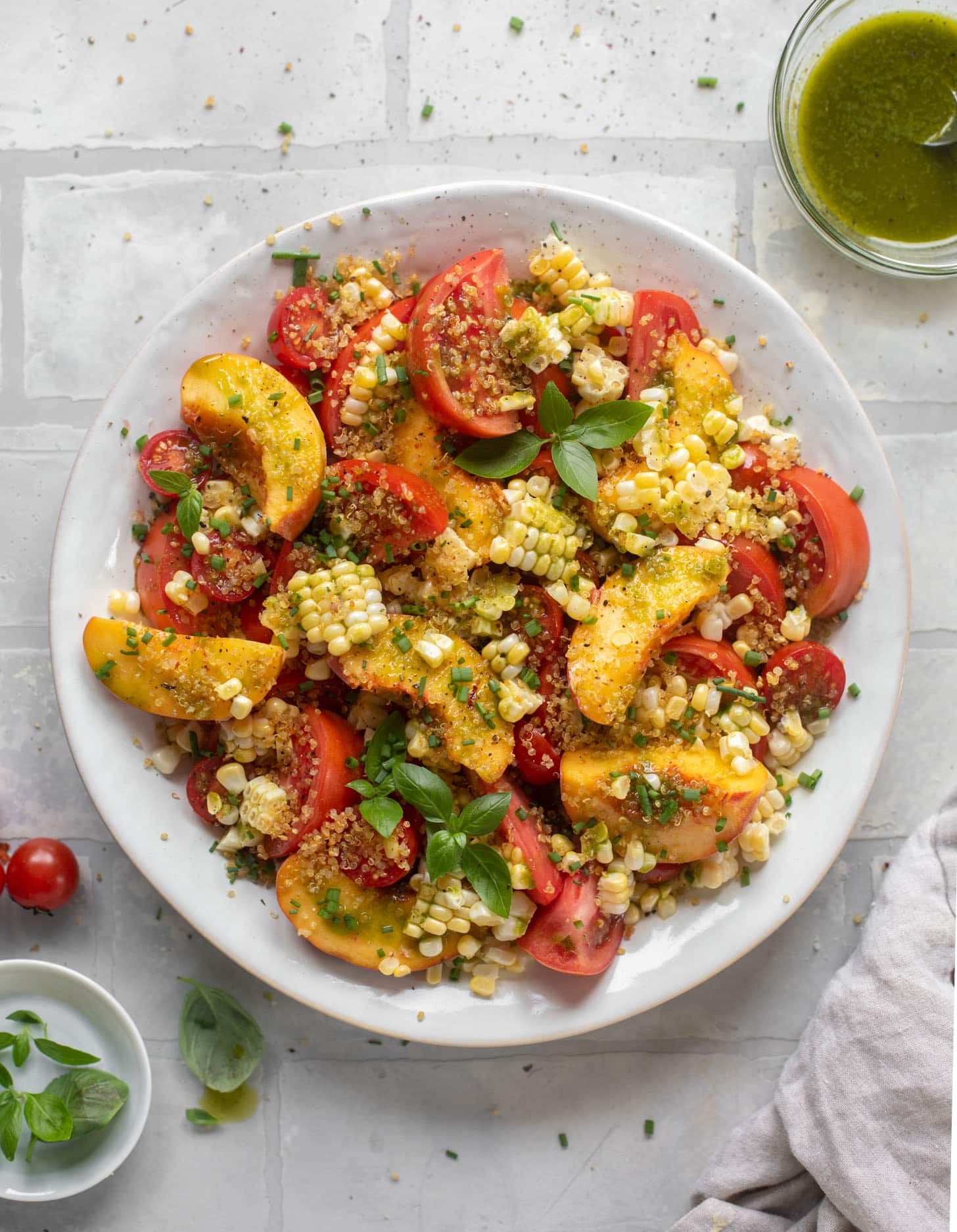 sweet corn, peach and tomato salad with crispy quinoa