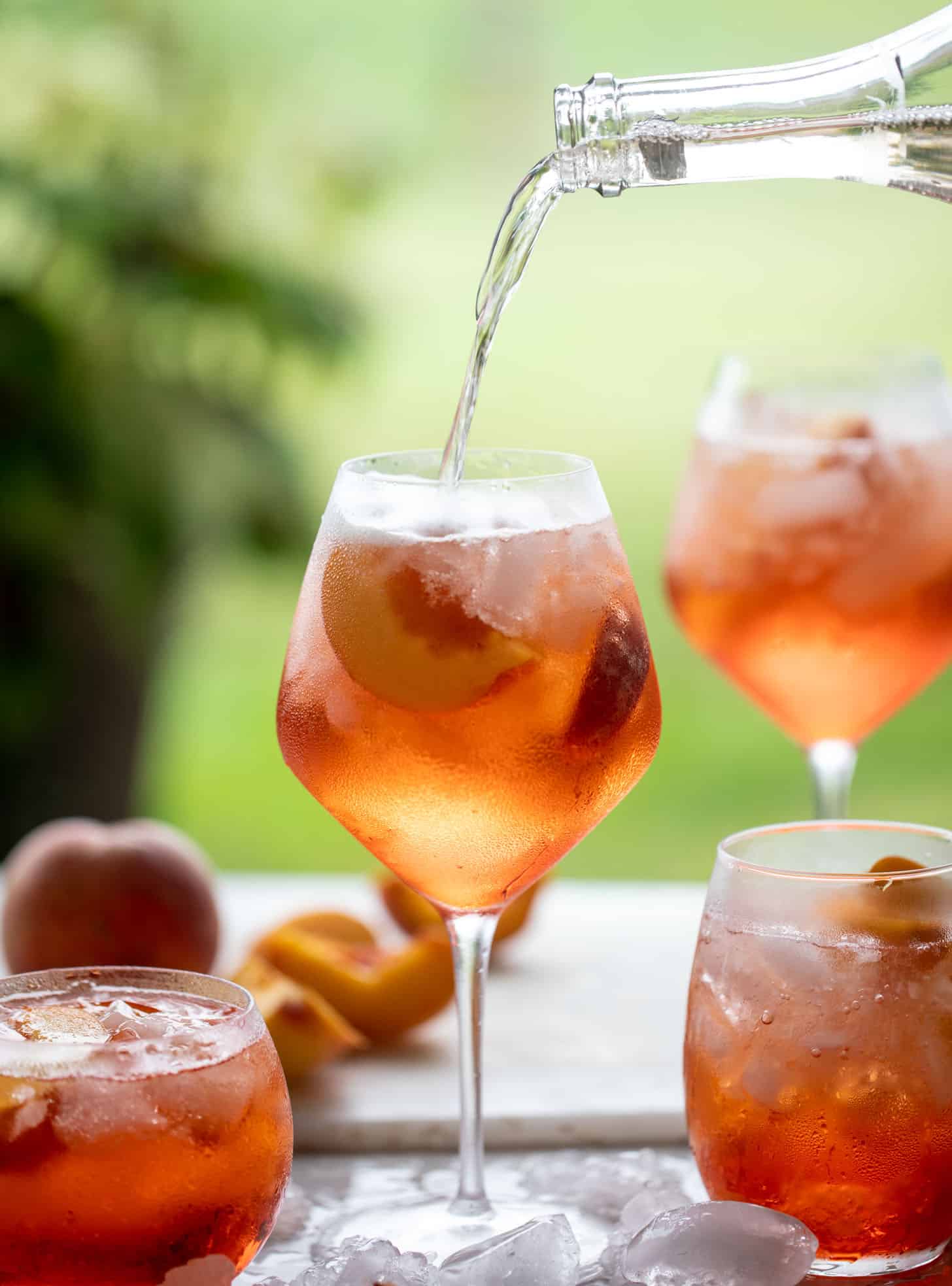 pouring sparkling rosé in aperol spritz 