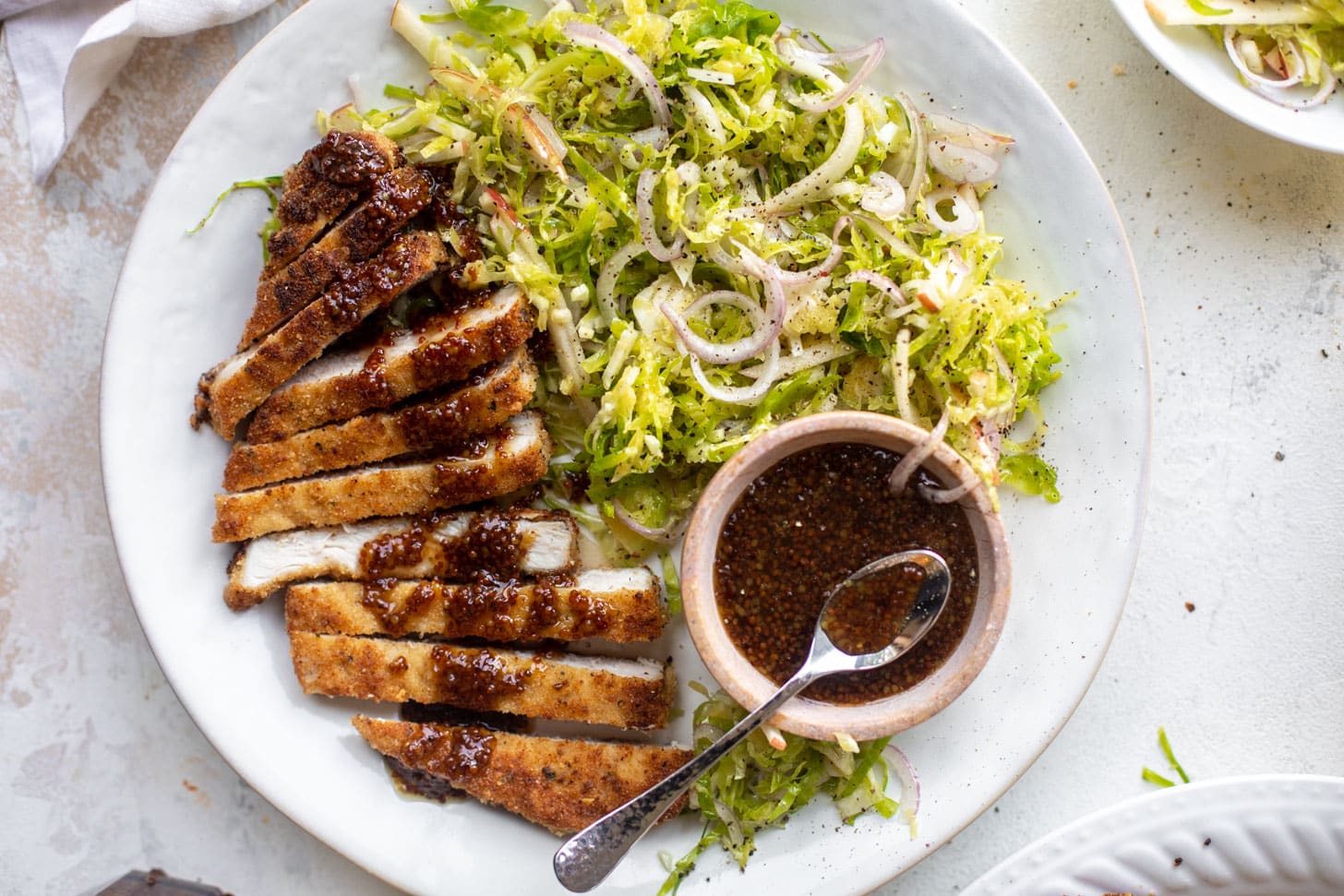 pork schnitzel with carolina gold BBQ sauce & brussels sprouts slaw