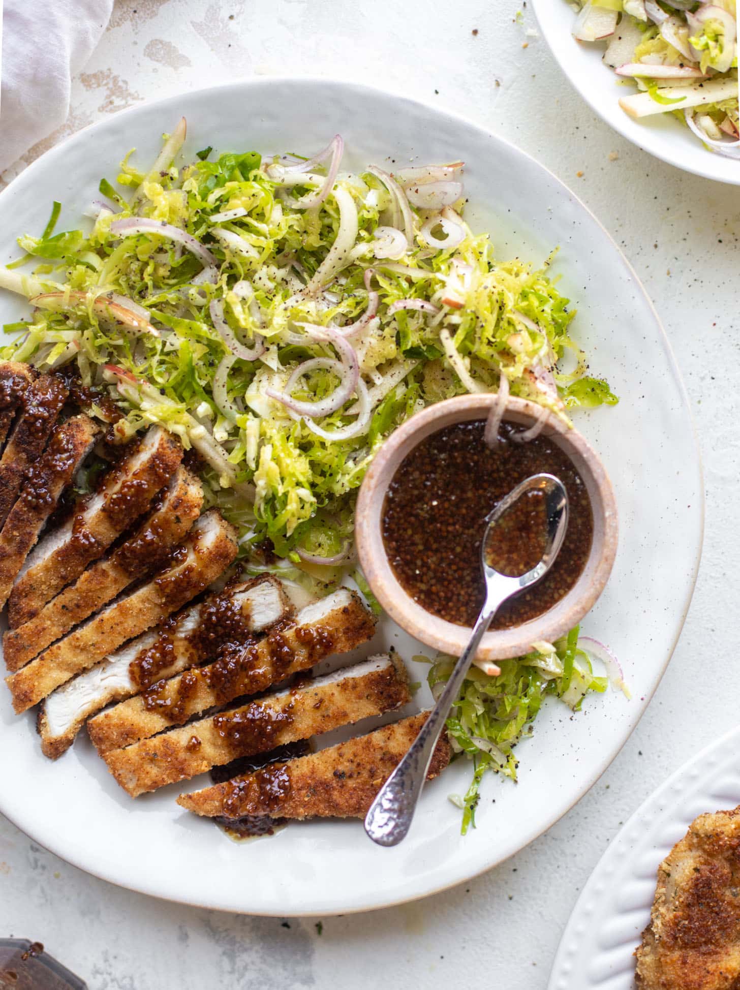 pork schnitzel with carolina gold BBQ sauce & brussels sprouts slaw