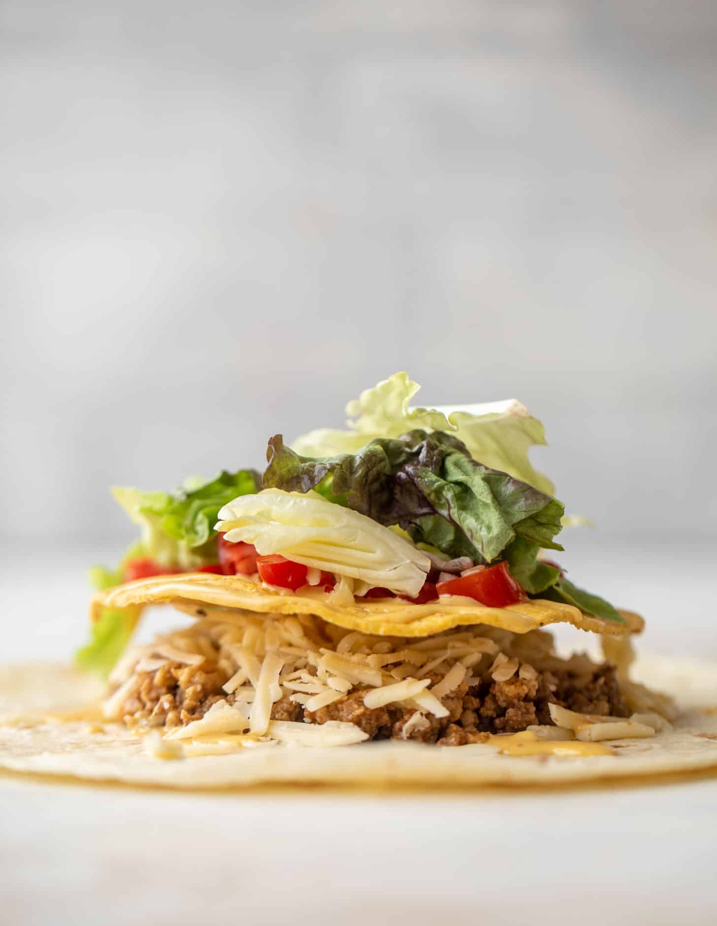 layering a cheeseburger crunchwrap