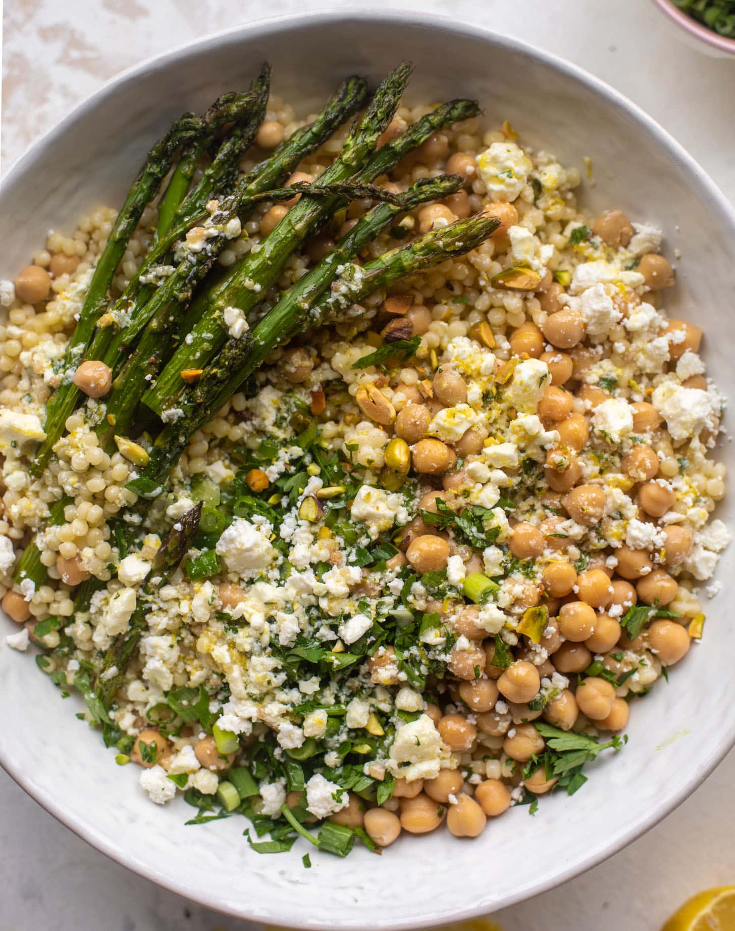 spring couscous bowls with lemon feta vinaigrette