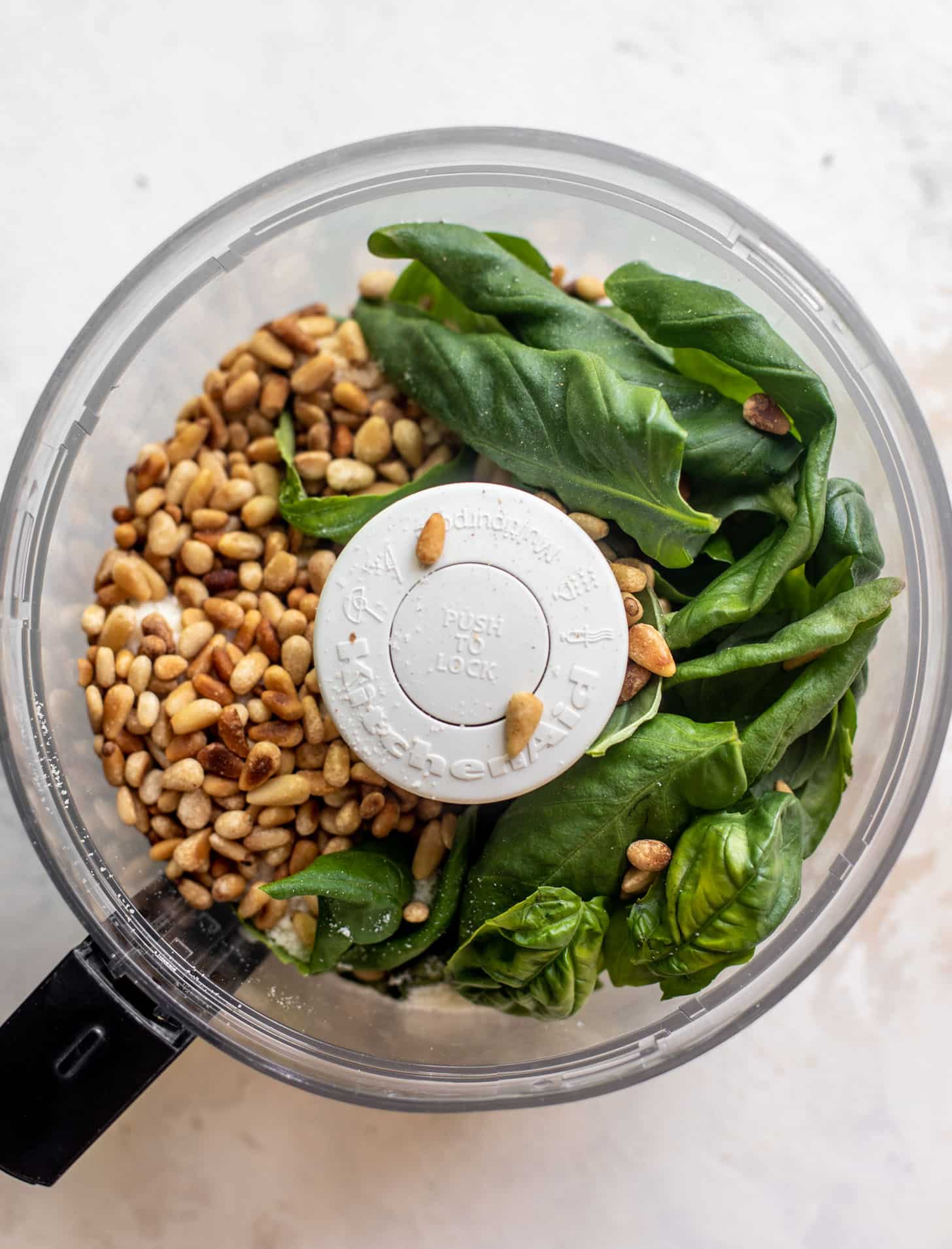 pesto ingredients in a food processor