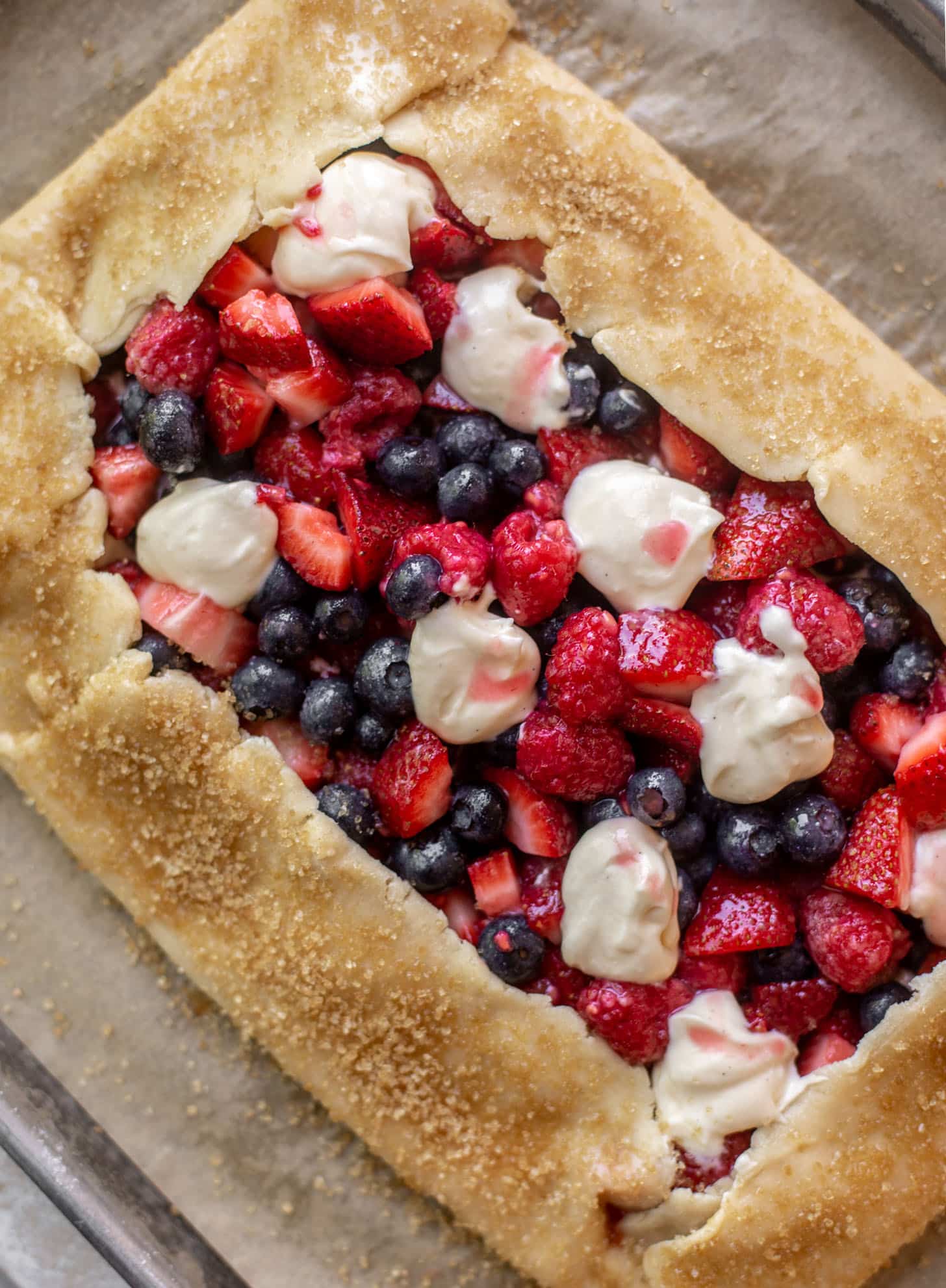 triple berry cheesecake galette ready for the oven