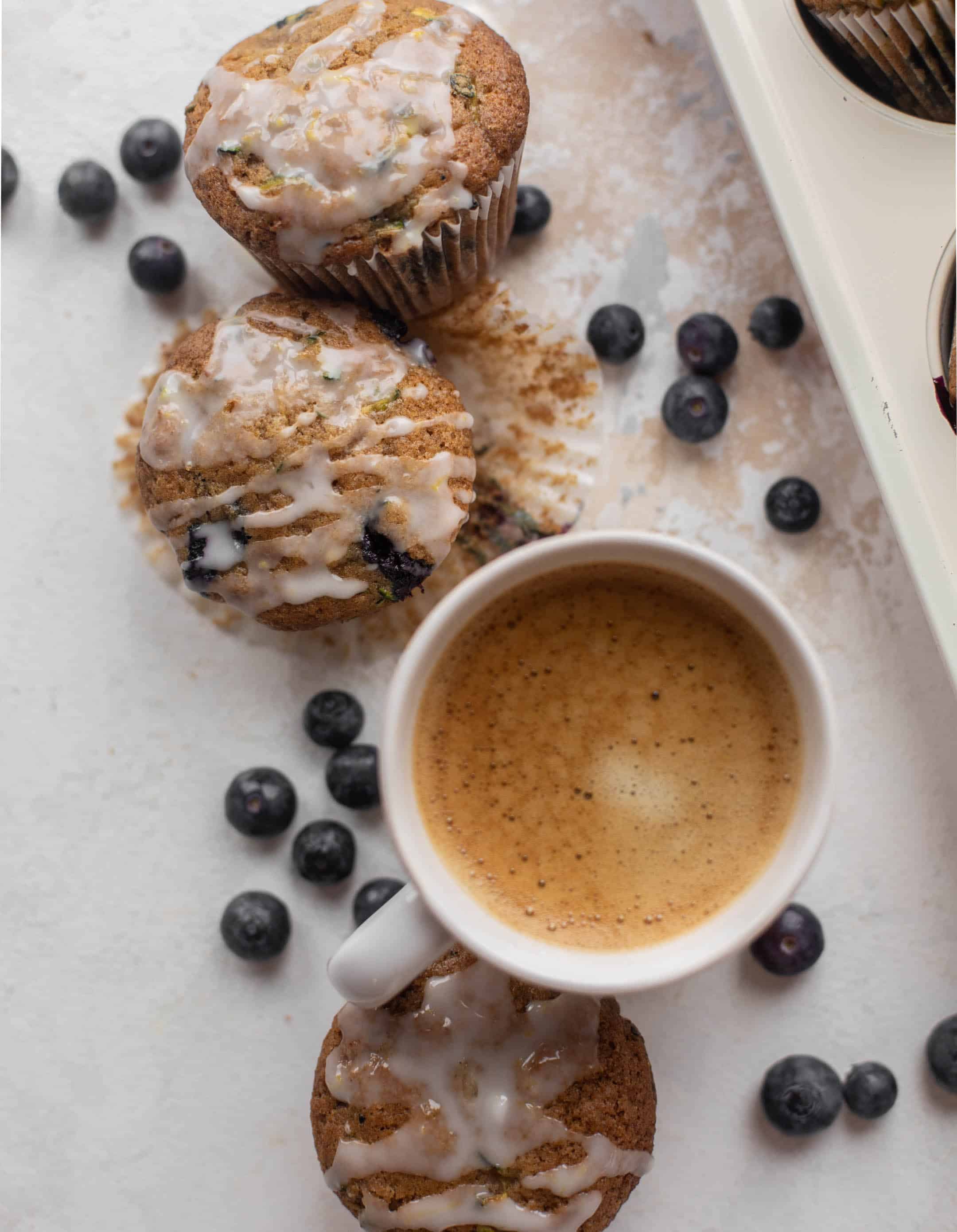 blueberry zucchini muffins with lemon glaze