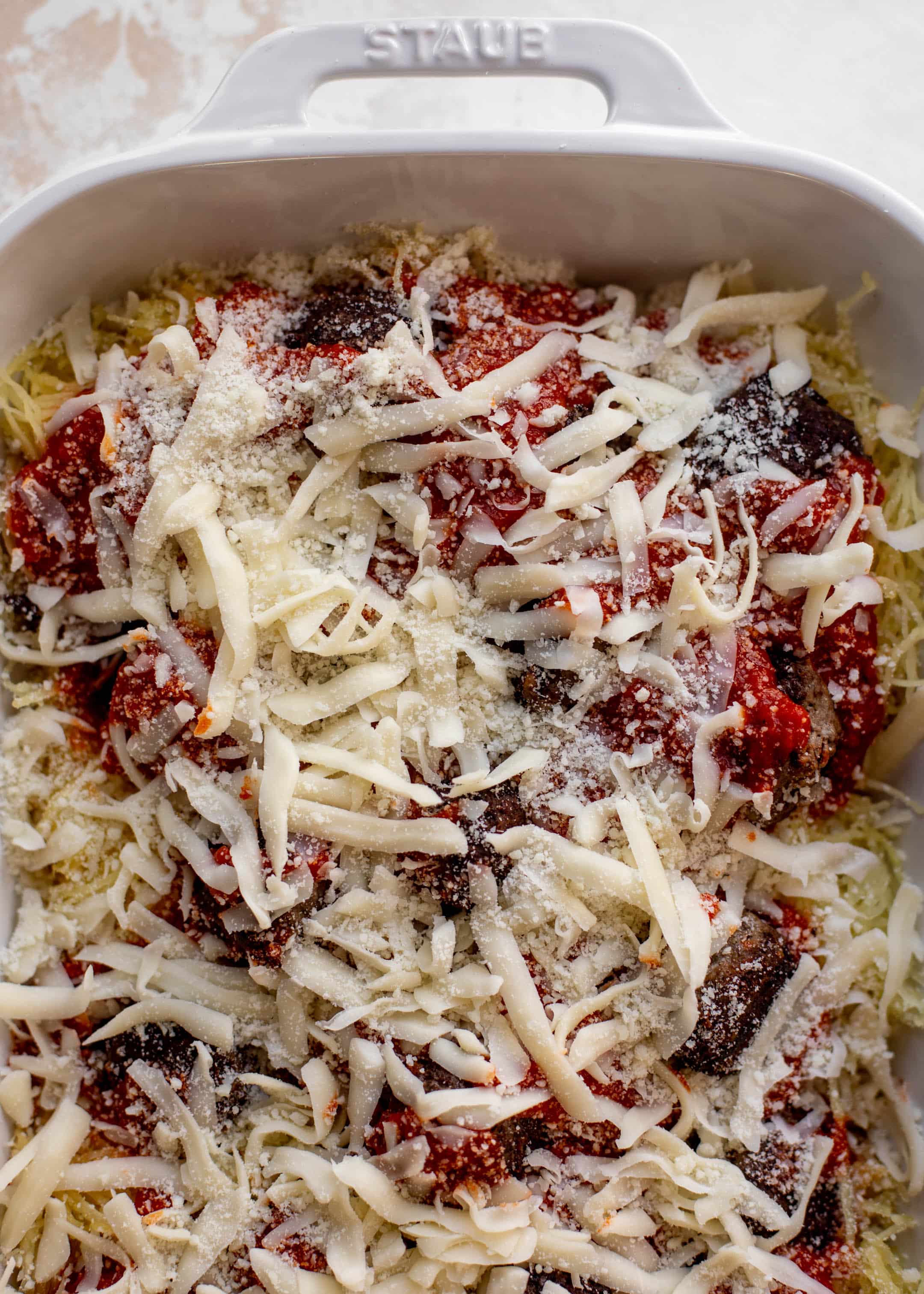 baked spaghetti squash and meatballs ready for the oven