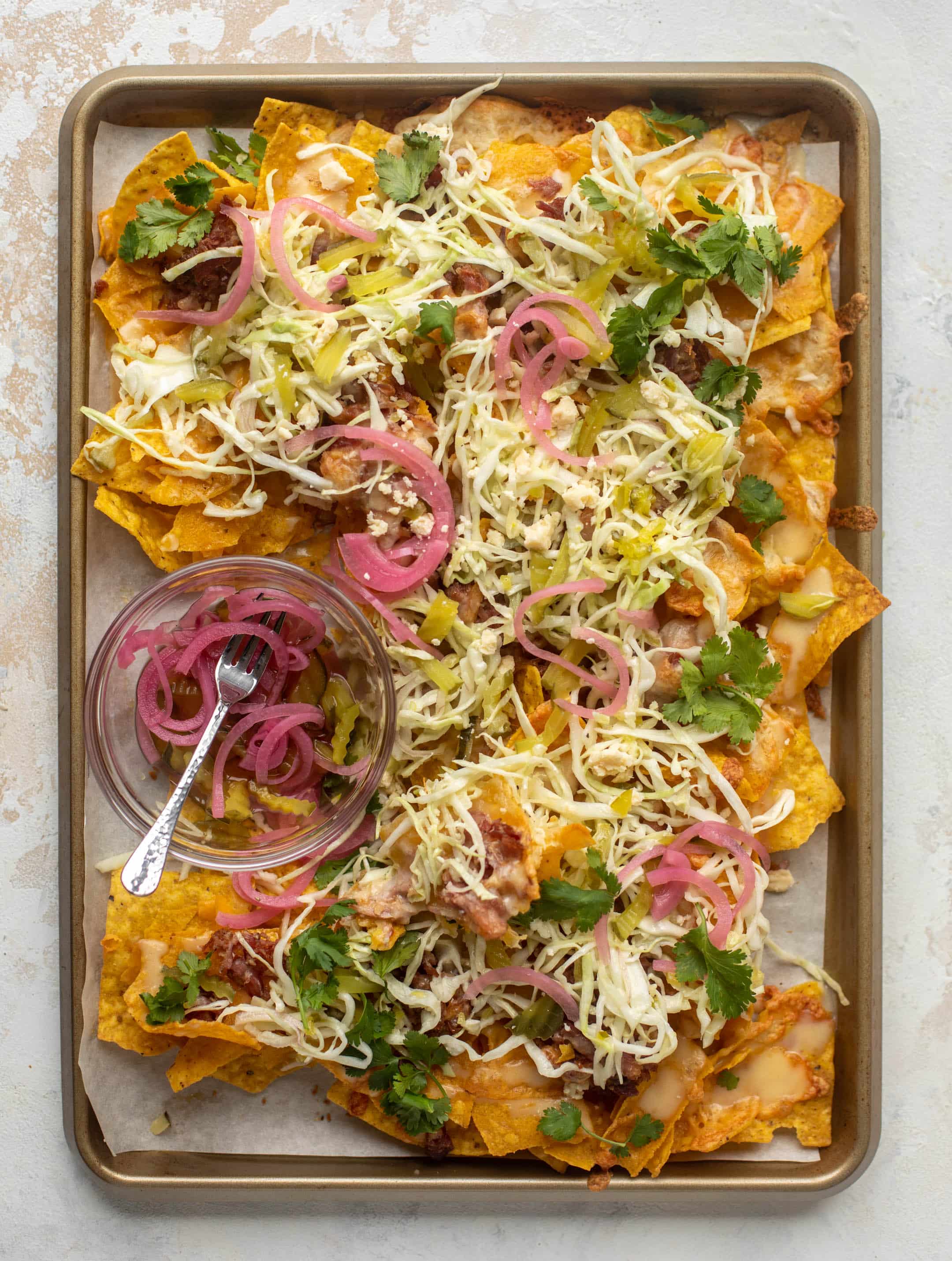 pulled pork nachos with pickle slaw