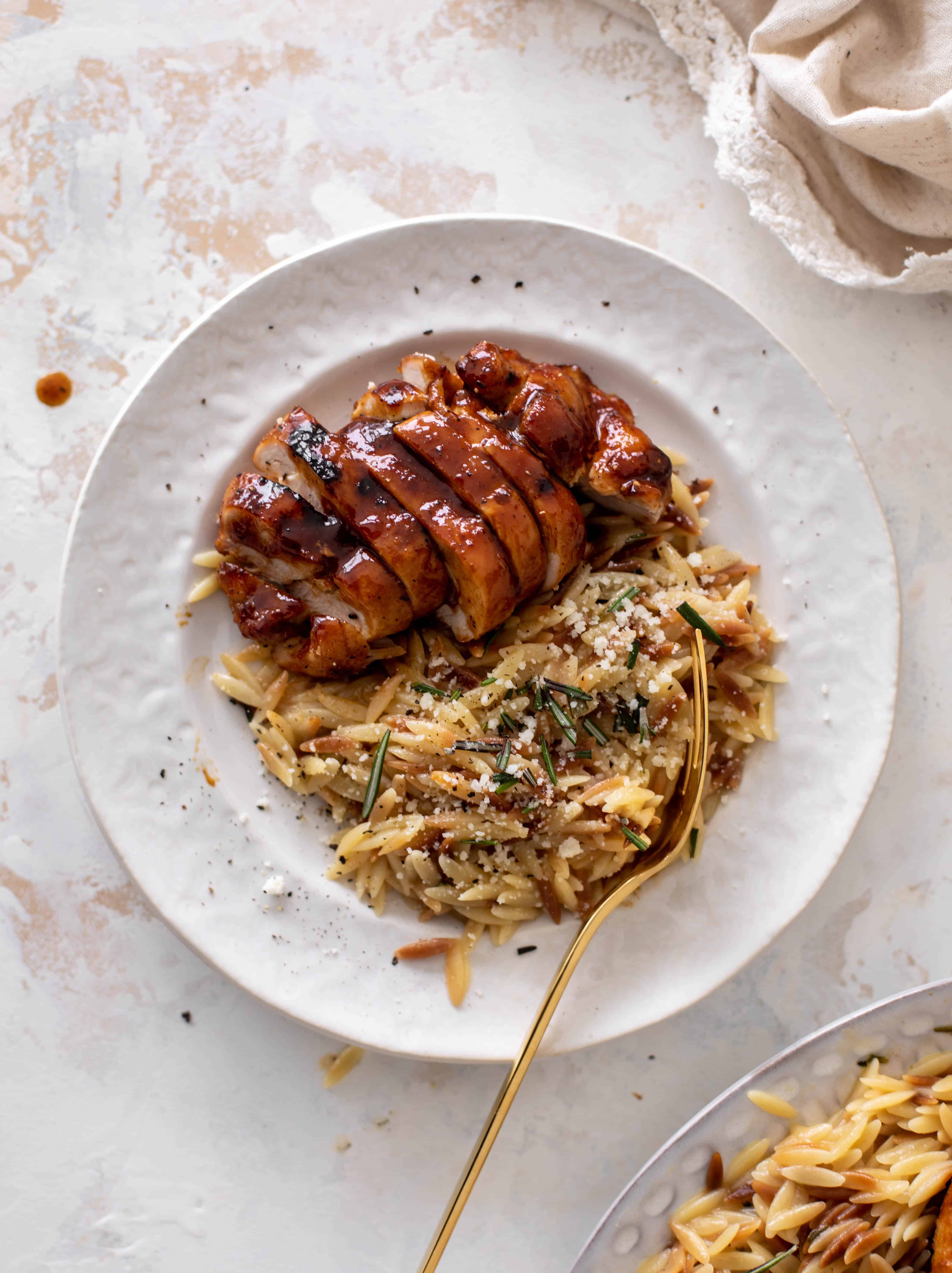 hot honey chicken thighs with rosemary orzo