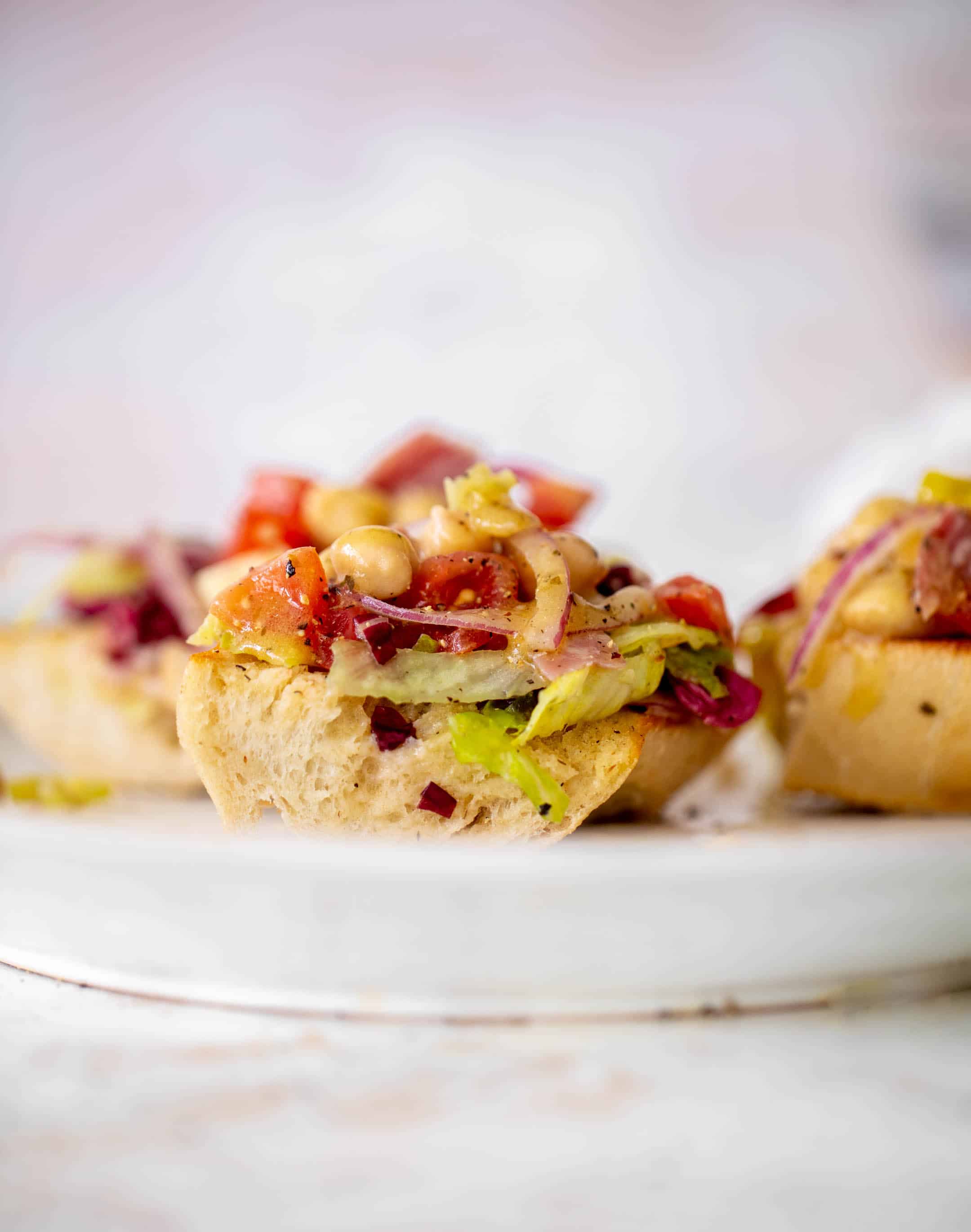 italian chopped salad on garlic bread