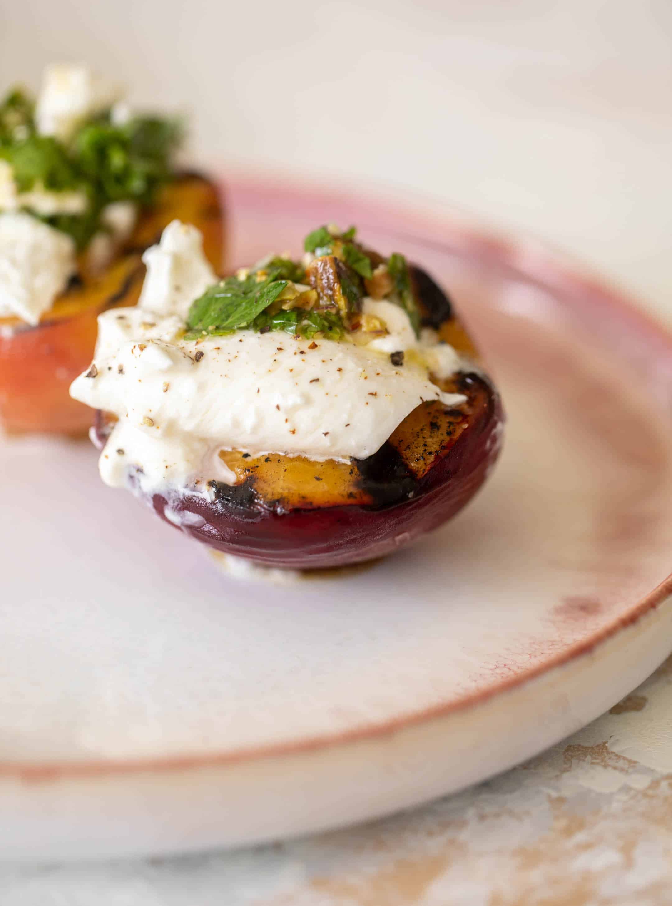 grilled peaches with burrata and pistachio vinaigrette