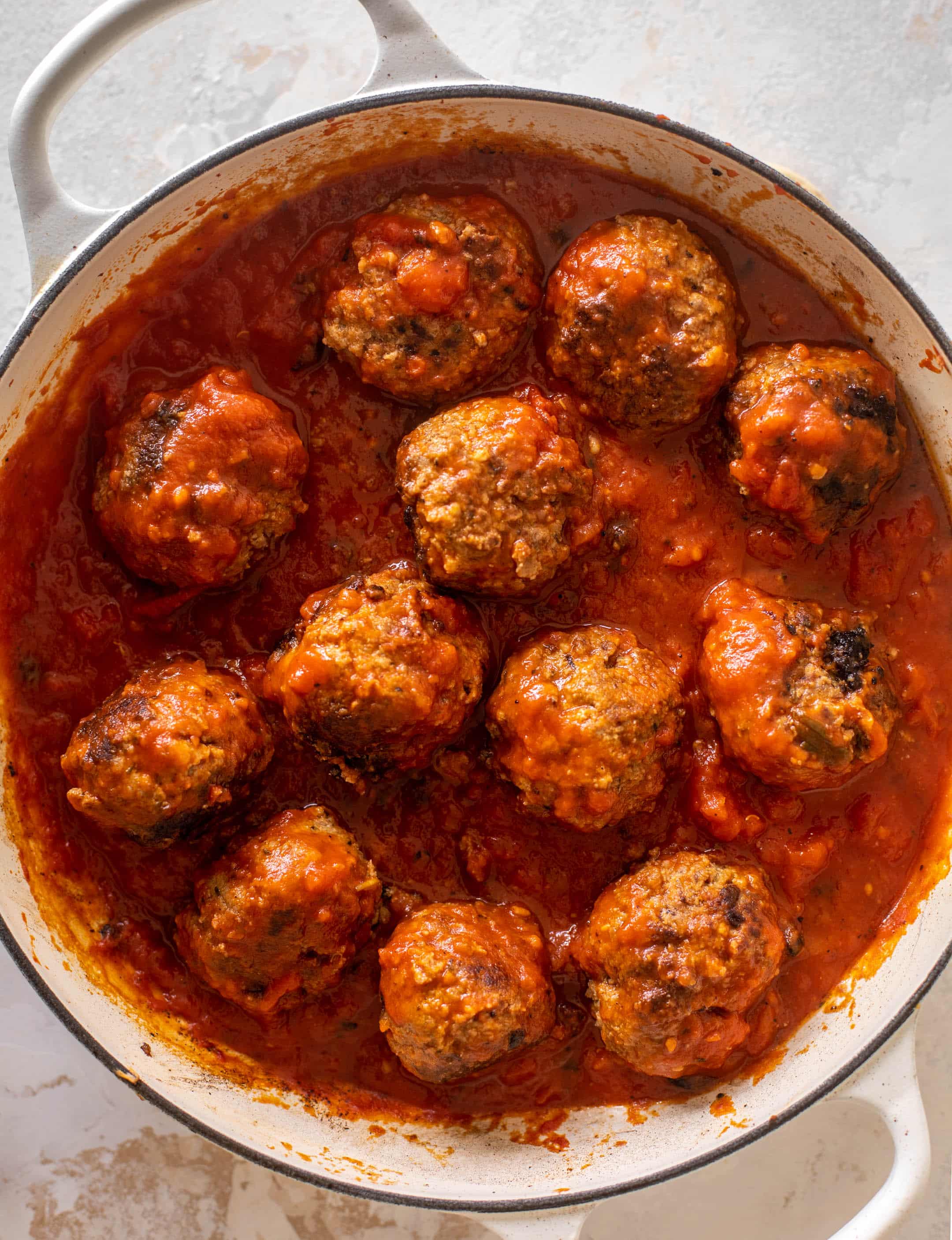 cheesy baked pesto meatballs with burrata