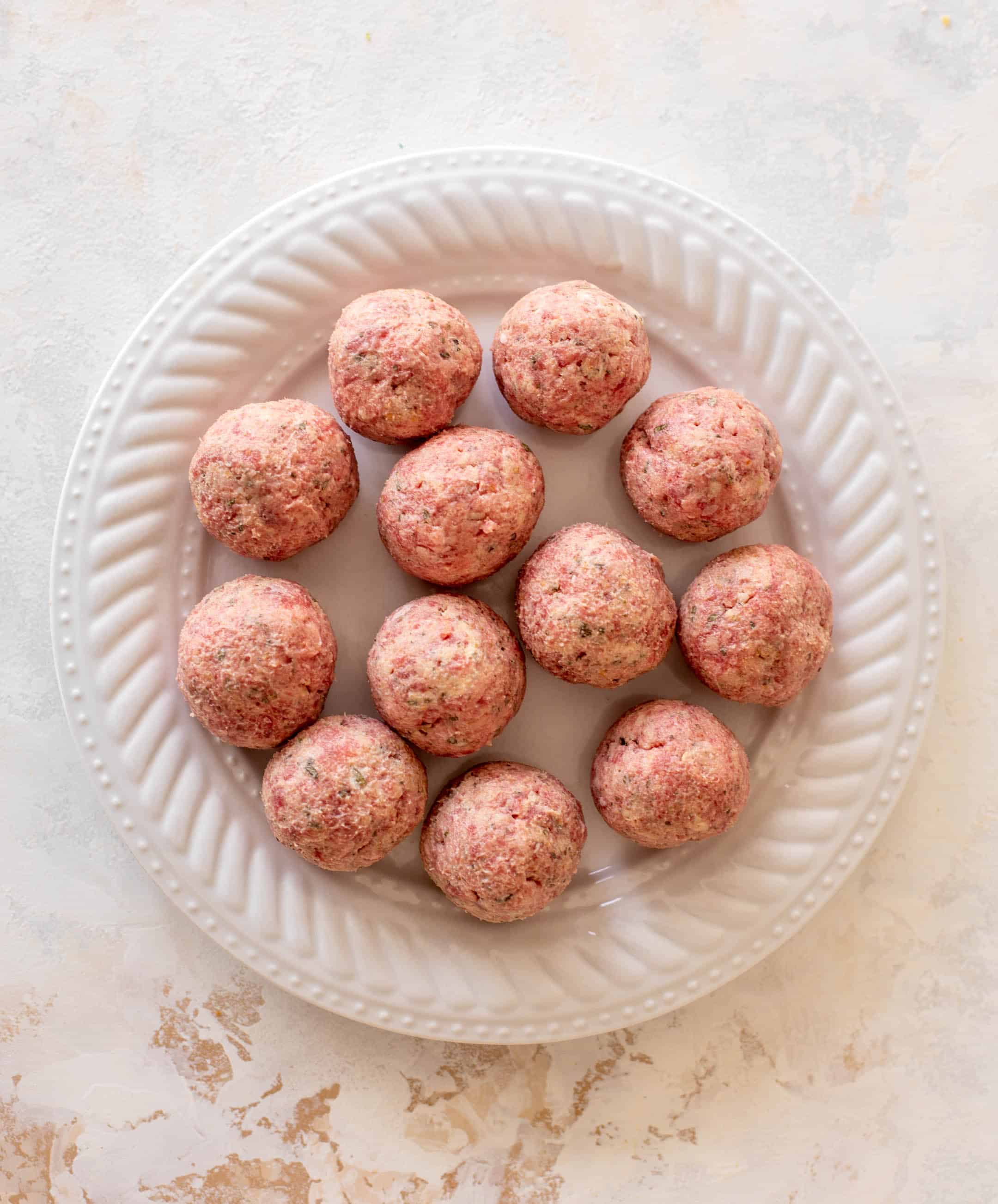 cheesy baked pesto meatballs with burrata