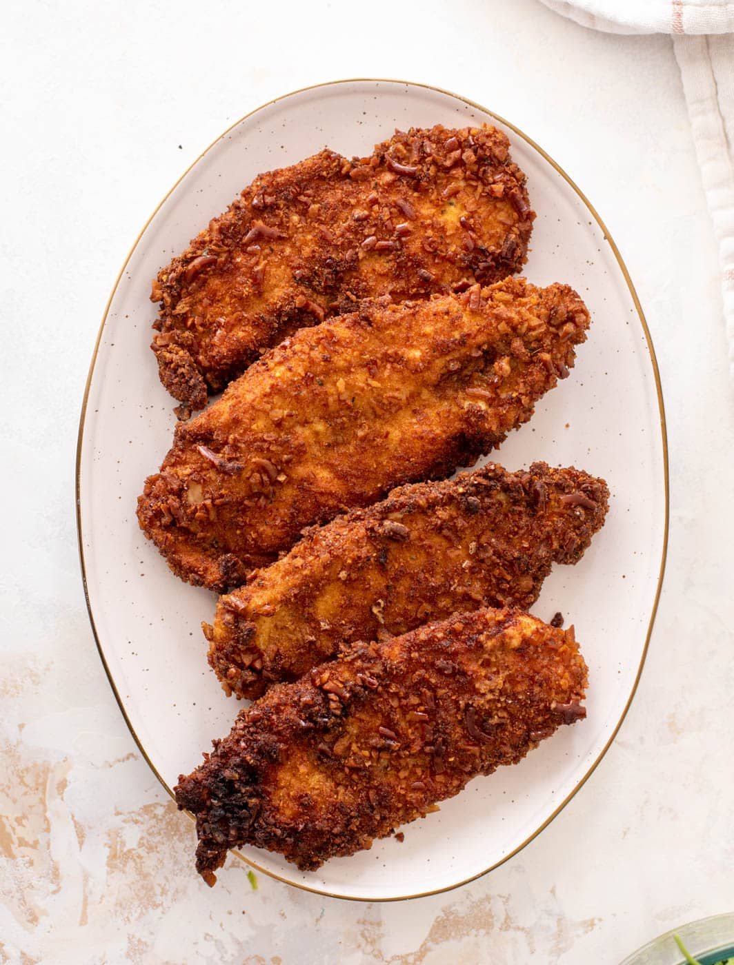 pretzel crusted chicken with honey mustard arugula