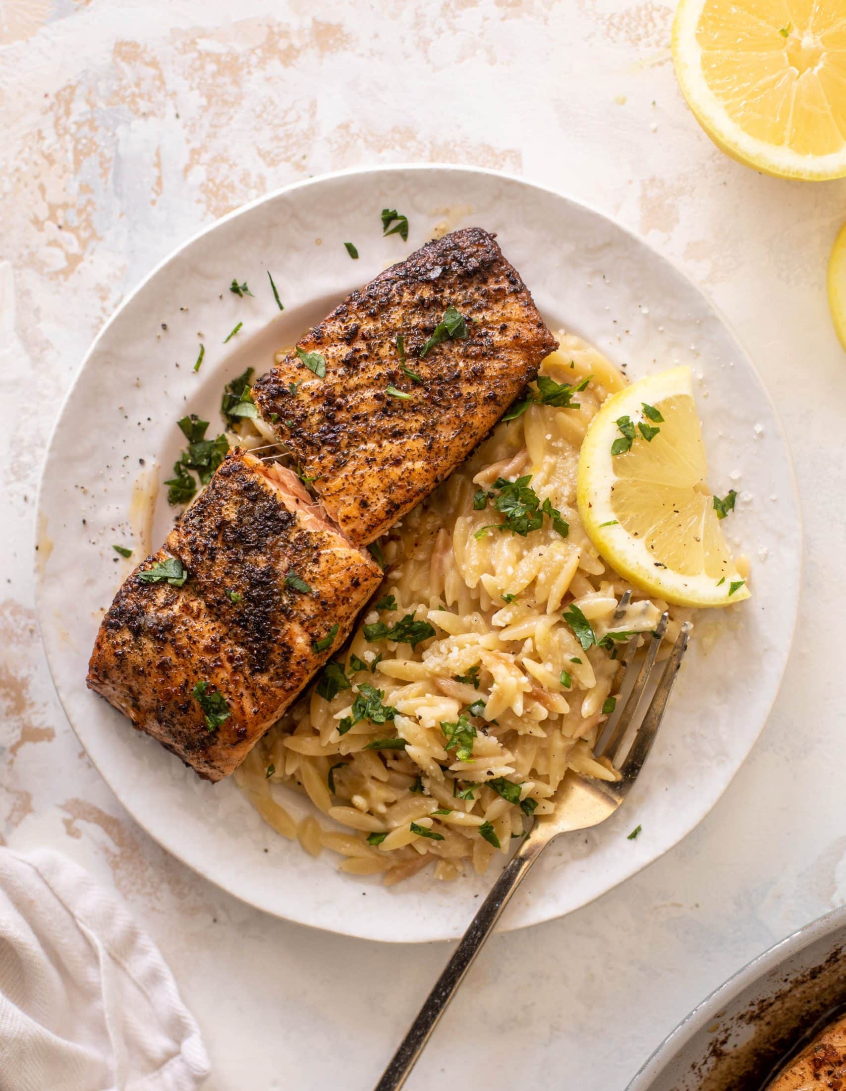 salmon aglio olio with lemon parm orzo