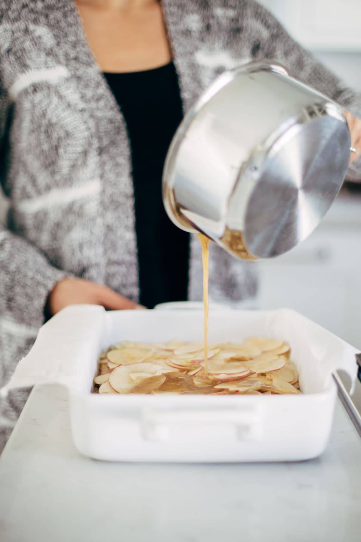 These layered bars are so simple! Loaded with homemade caramel and apples. Caramely apple layer tucked in by a brown sugar-y crust on both sides. | pinchofyum.com