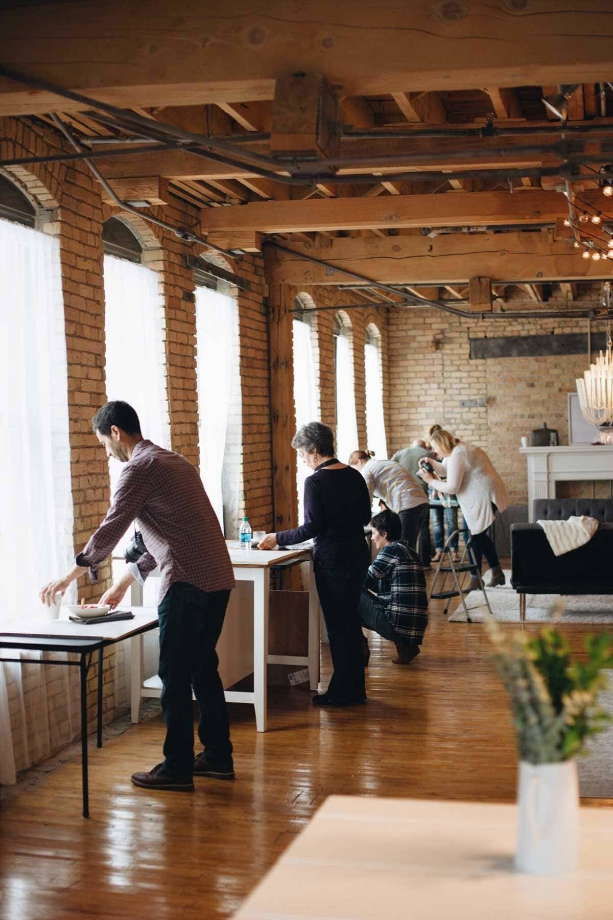 People in a studio styling food.